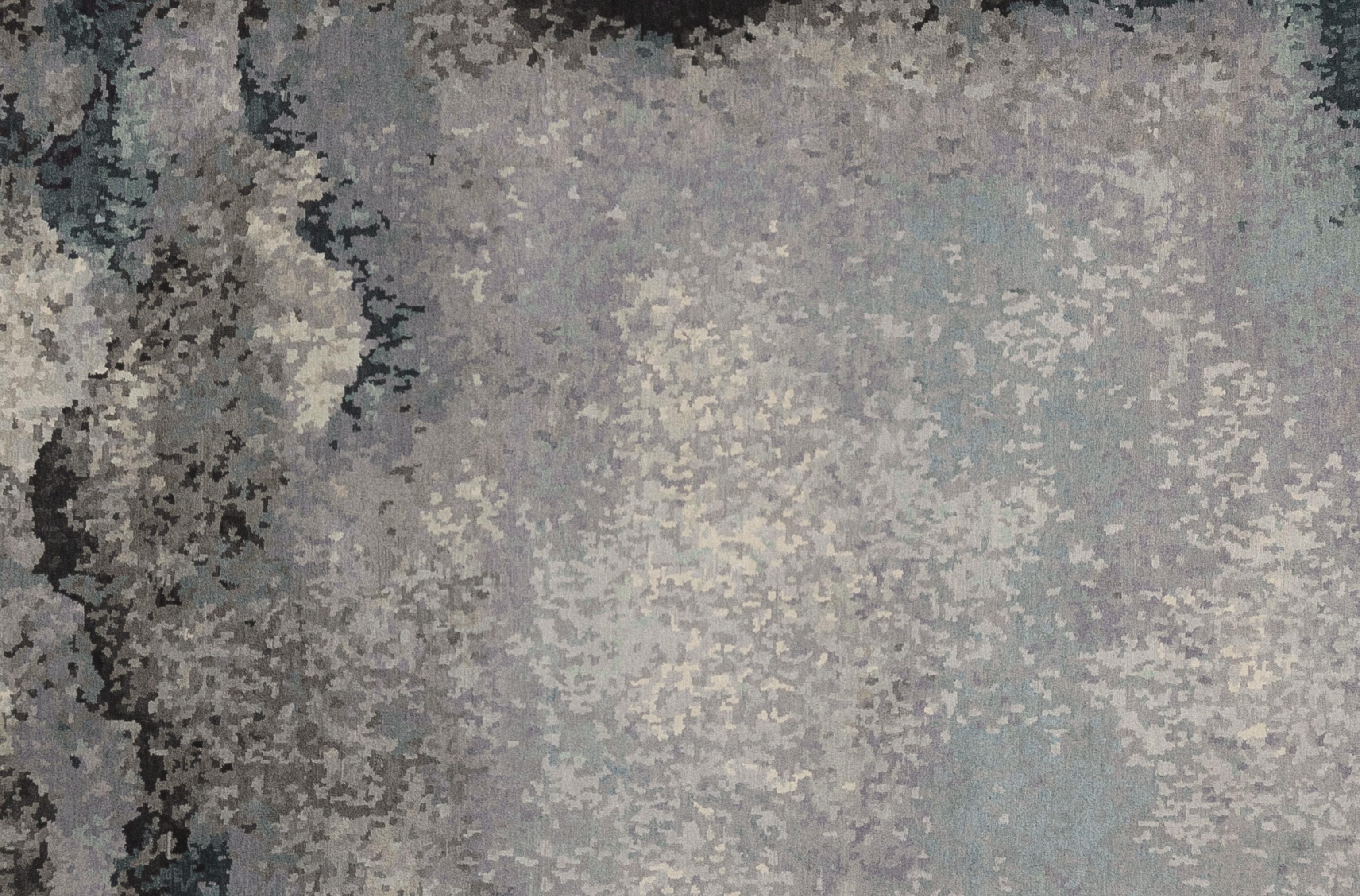 Enhance your home with this luxurious contemporary silk and wool rug, meticulously handcrafted in Nepal. This exquisite piece features a stunning array of vibrant tones, creating a visually captivating centerpiece for any room. The blend of premium