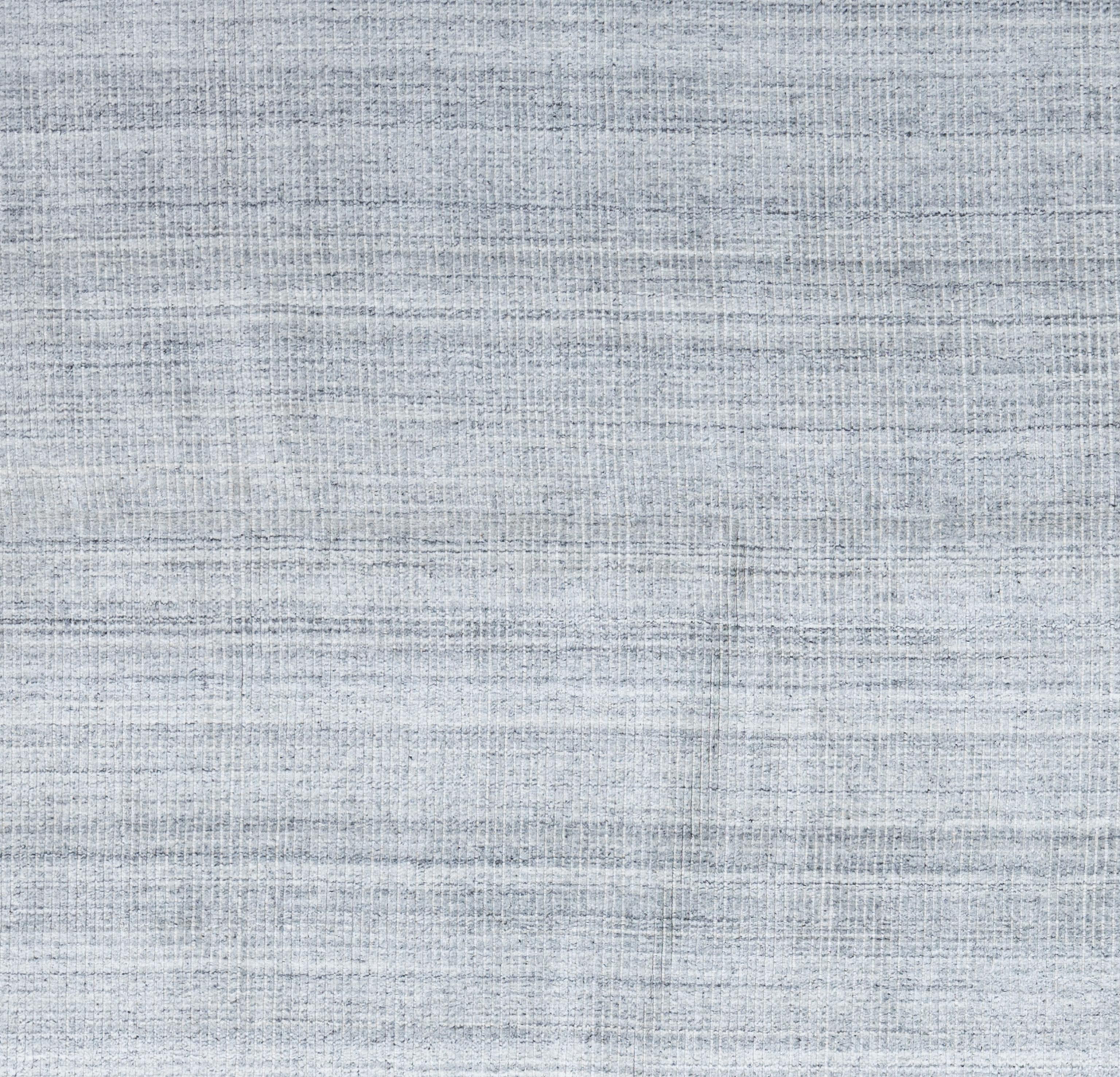 Rehaussez votre espace de vie avec l'allure intemporelle de notre tapis Contemporary fabriqué à la main, directement par les artisans de l'Inde. Chaque tapis témoigne de siècles de tradition et de savoir-faire, méticuleusement tissé avec des motifs