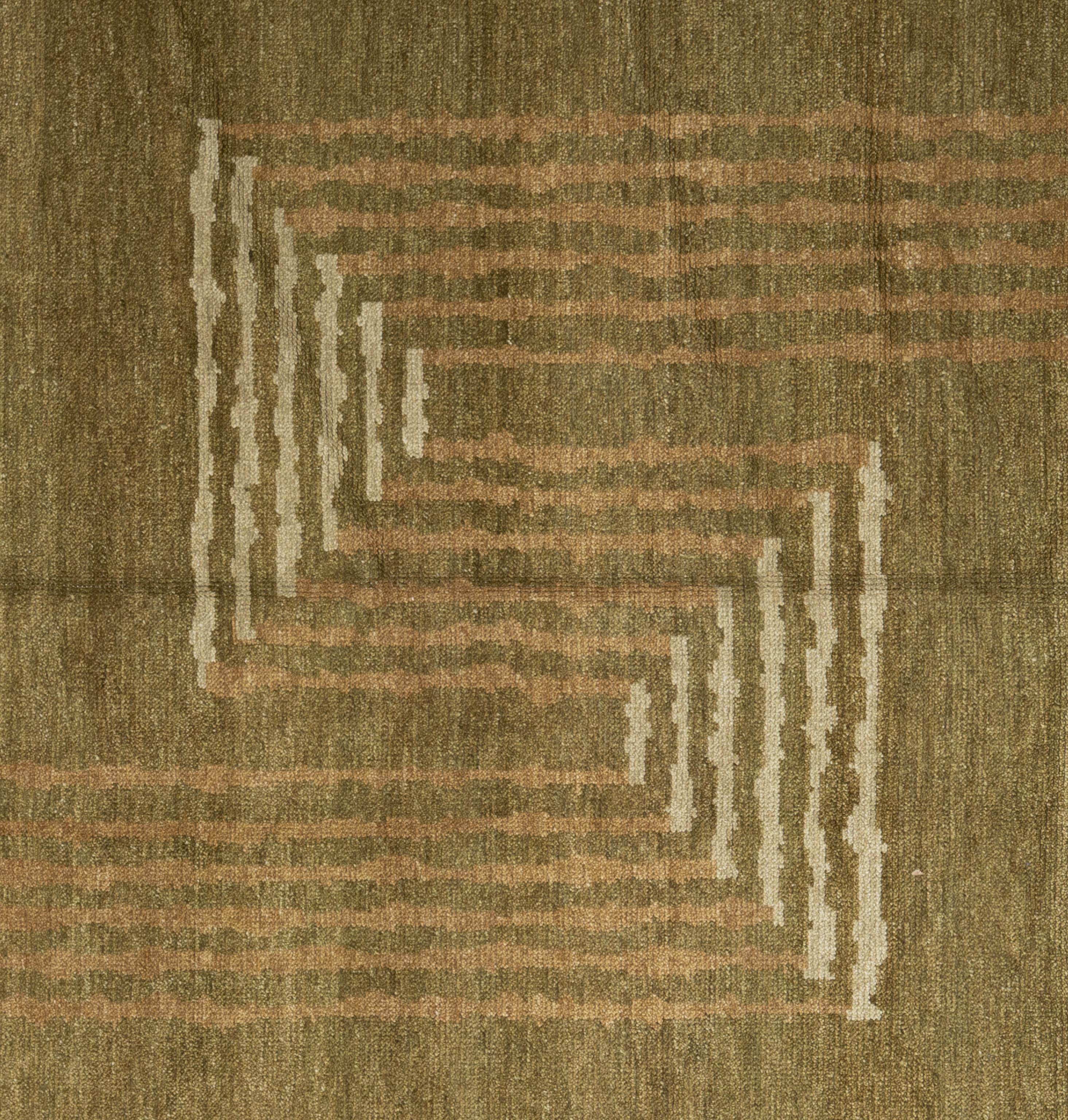 Enhance your home with this luxurious Contemporary wool rug, meticulously handcrafted in Nepal. This exquisite piece features a stunning array of earthy tones, creating a visually captivating centerpiece for any room. Crafted by skilled artisans,
