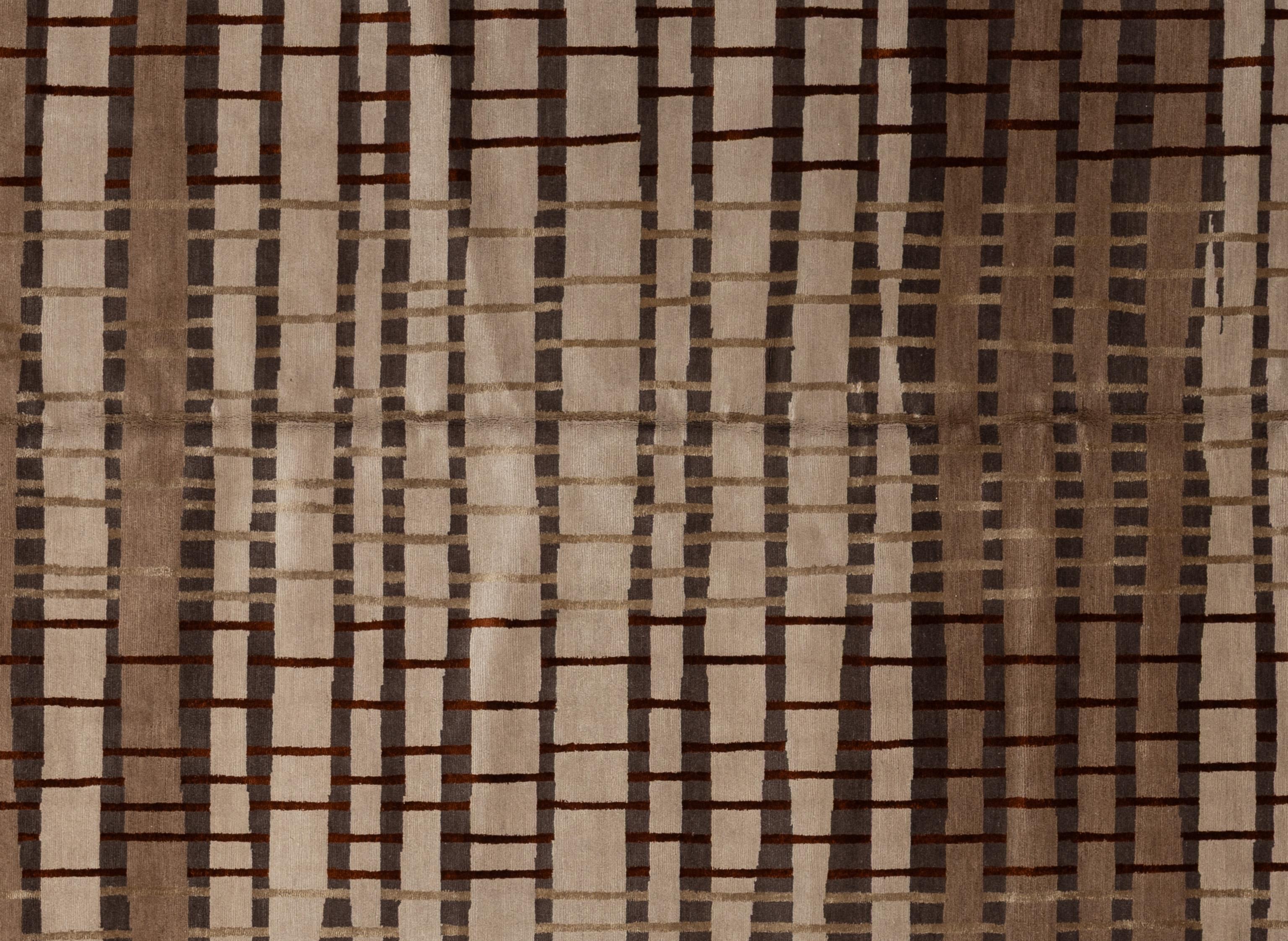 Enhance your home with this luxurious Contemporary wool rug, meticulously handcrafted in Nepal. This exquisite piece creates a visually captivating centerpiece for any room. Crafted by skilled artisans, the rug showcases intricate patterns that