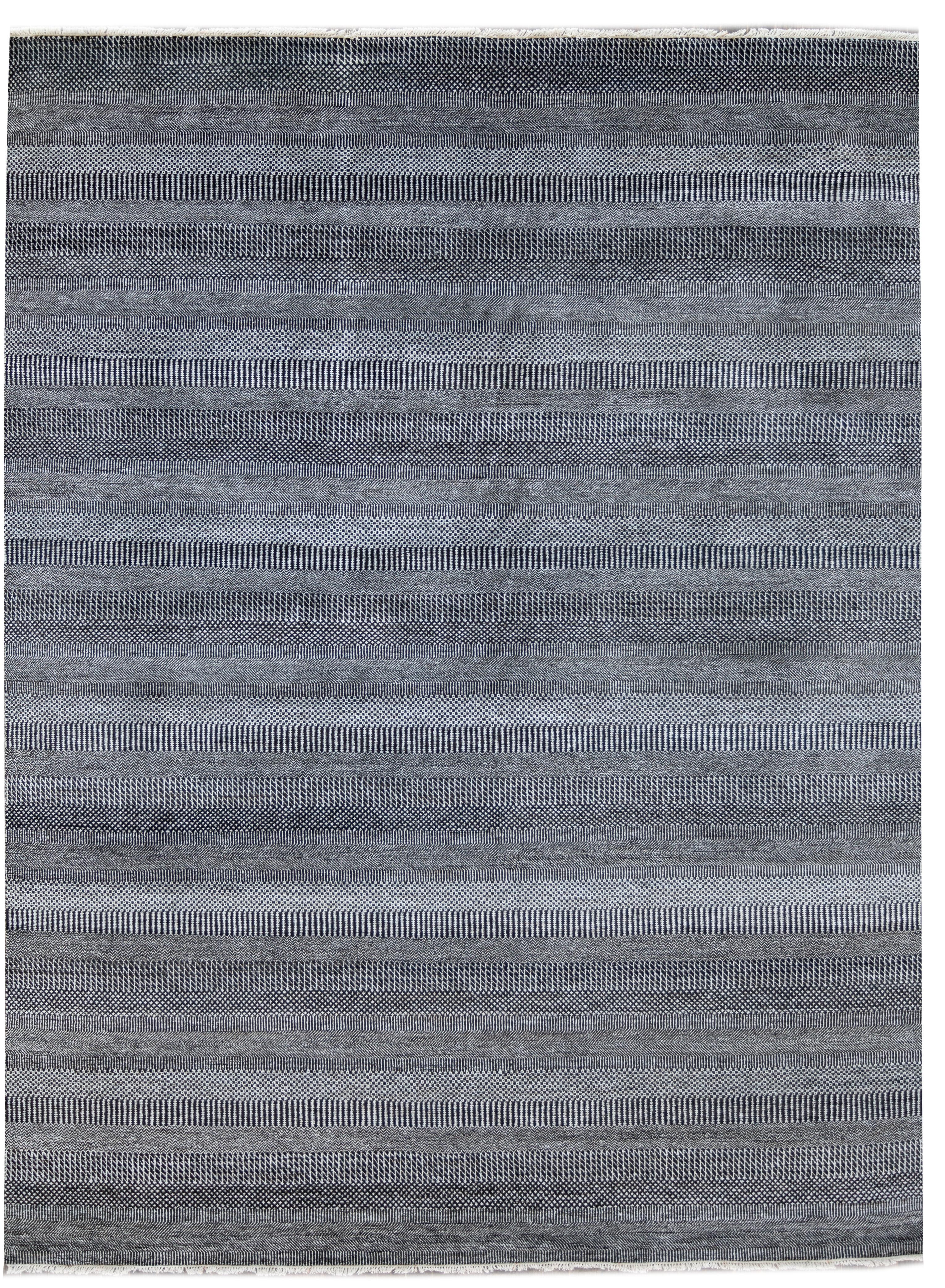 A 21st century contemporary transitional Savannah rug with a finely-detailed black and light silver allover design. This hand knotted wool rug measures 9'1