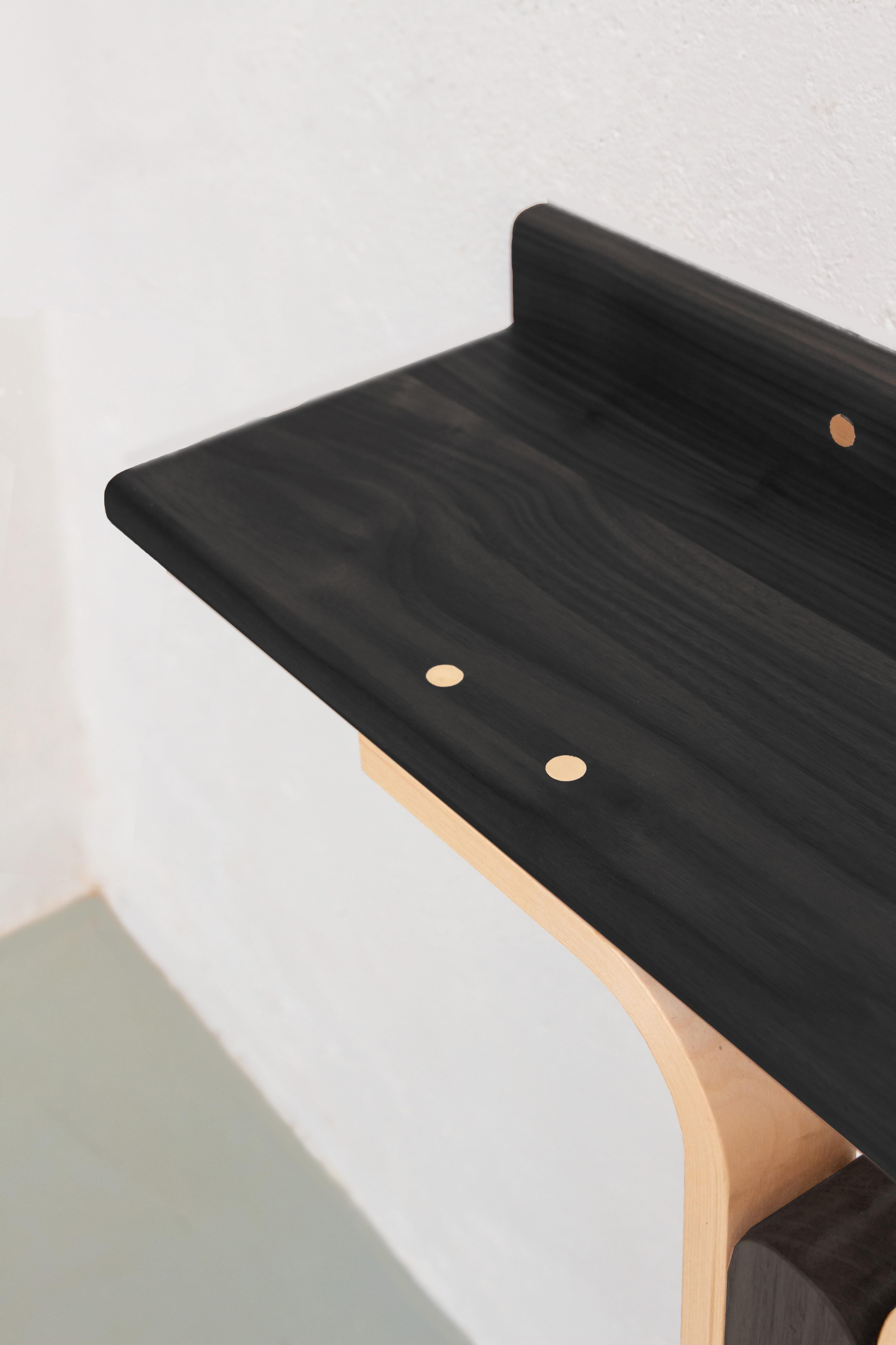 Solid black stained ash wood, ashwood bent elements, brass joinery.
Measures: 25 x 80 x 90 cm.
Designed by Ilaria Bianchi, Handmade in Italy by master carpenters.

The elegant 21st-century Rennie console table by Ilaria Bianchi is handcrafted in