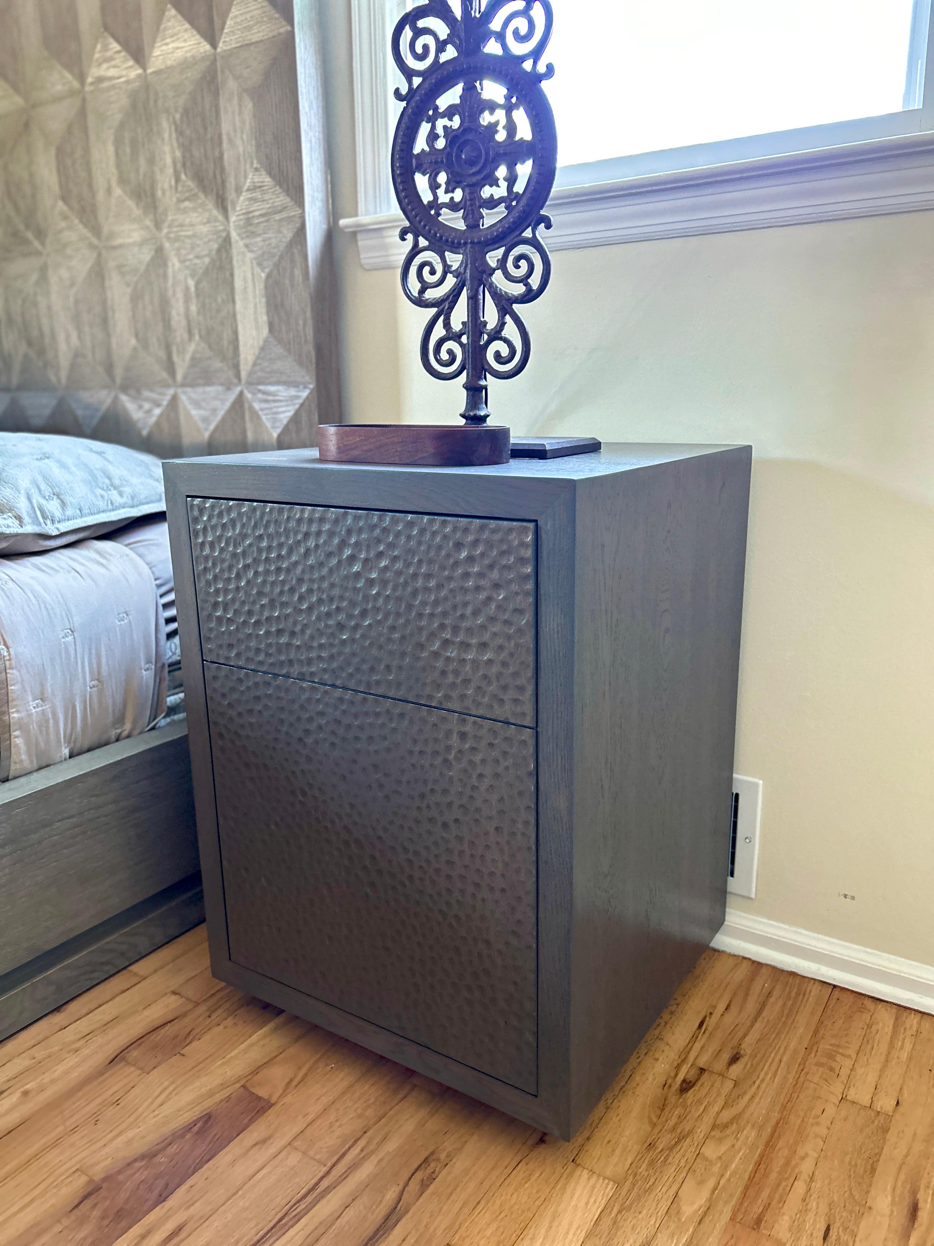Introducing the White Oak CPAP Nightstand from Walker Design Studios, a luxurious addition to your bedroom. This meticulously crafted nightstand features a stunning white oak exterior, enhanced with intricate hand-gouged detailing on its doors and