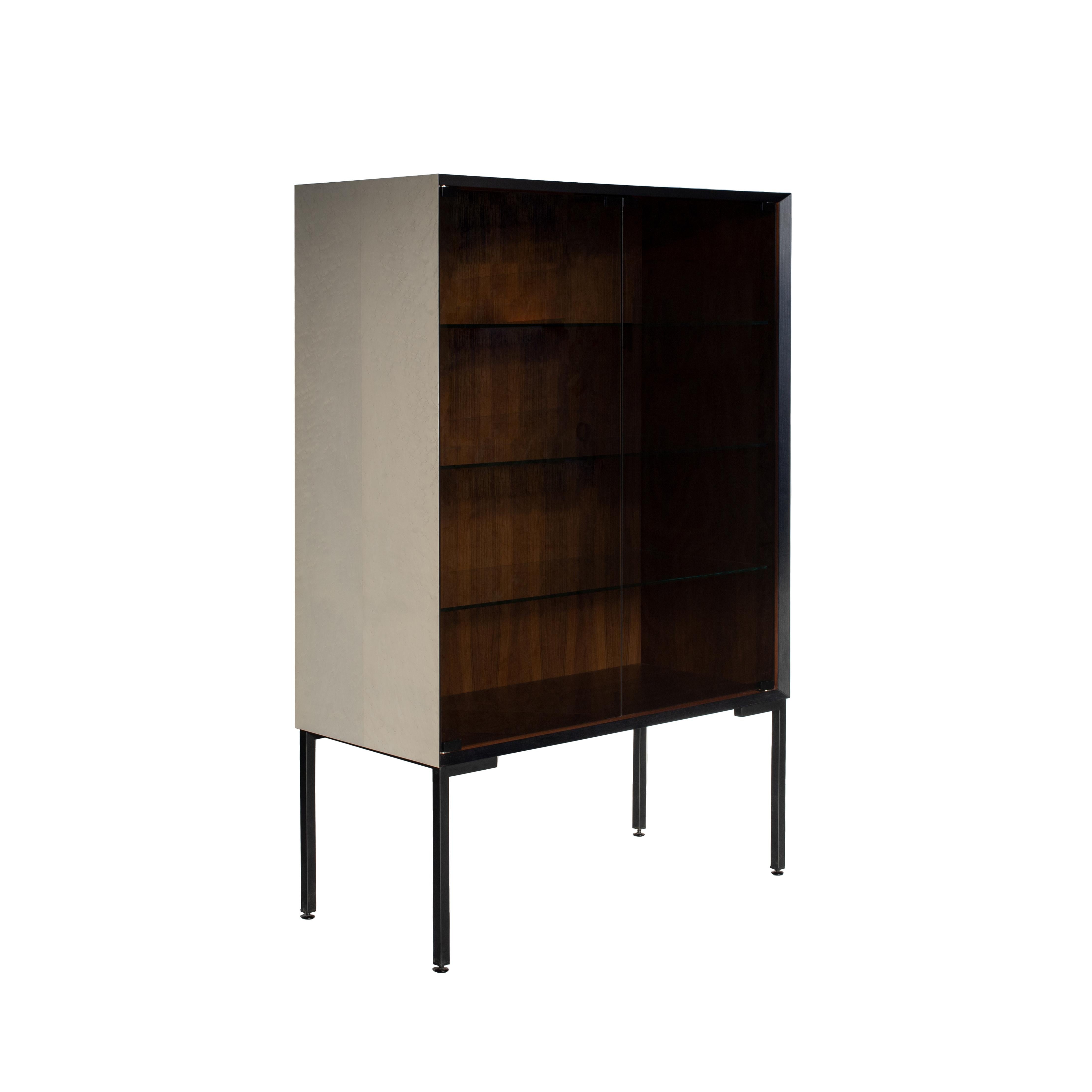 Cabinet in Bois de Violette, black stained ash and bleached maple, Canaletto walnut interior, matt black finish brushed iron feet. Doors and central shelves in smoked glassAlso available in cedar or other woods on request.

Designer:
Hebanon