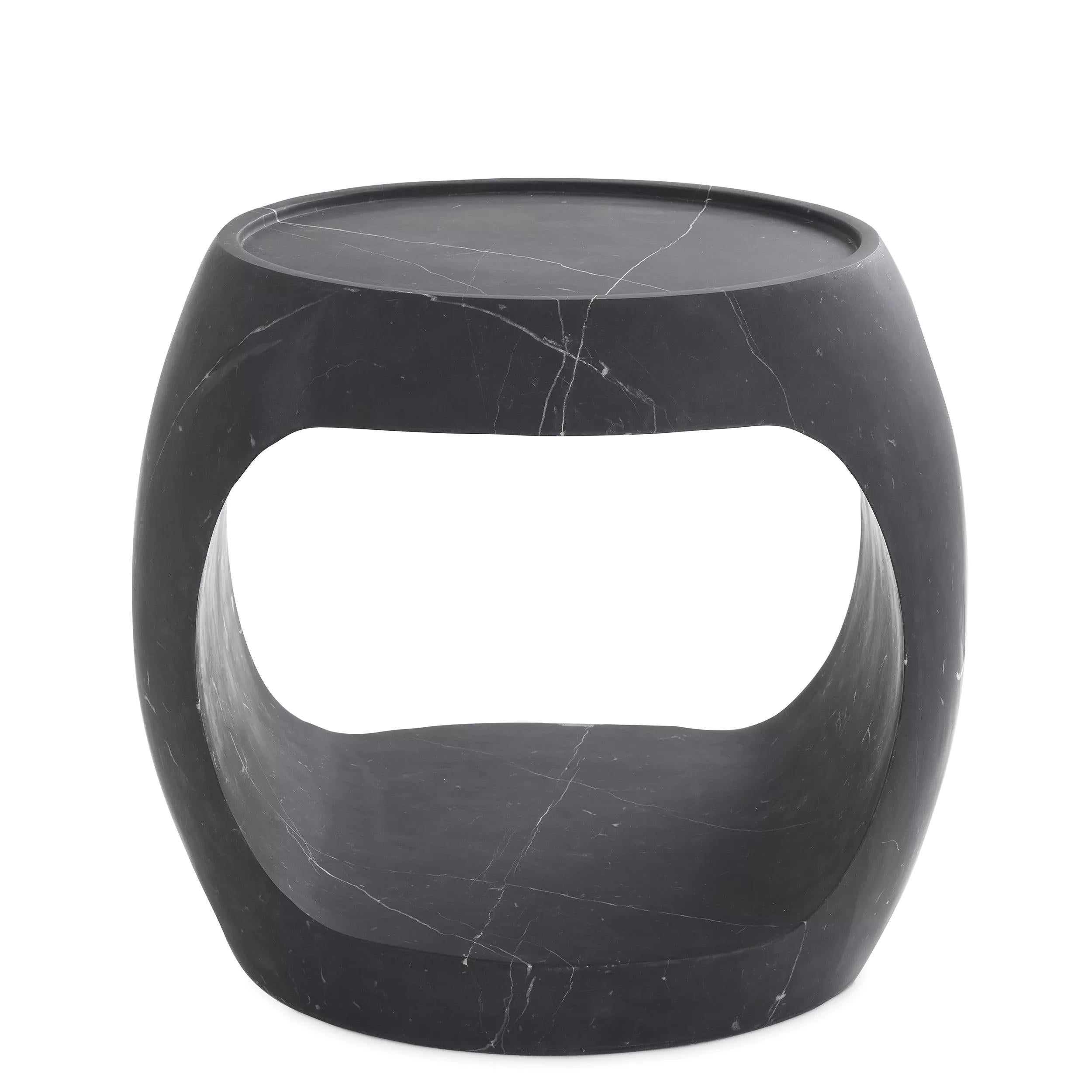 Carved from a solid block, this hollowed oval shaped marble side table is hand-crafted and honed for a mat and soft touch finish. Custom marble requests and bespoke dimension available upon request. Please note that marble is a natural product,