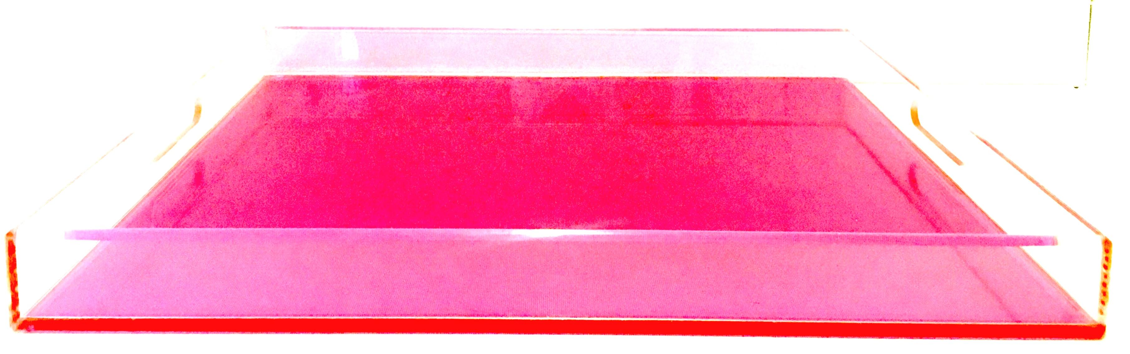 21st century Modern custom made in the style of Alexandra Von Furstenberg, neon pink and clear large, cut-out handle Lucite tray. This well constructed Lucite tray has been fabricated to the highest standards with beveled edges and is .25