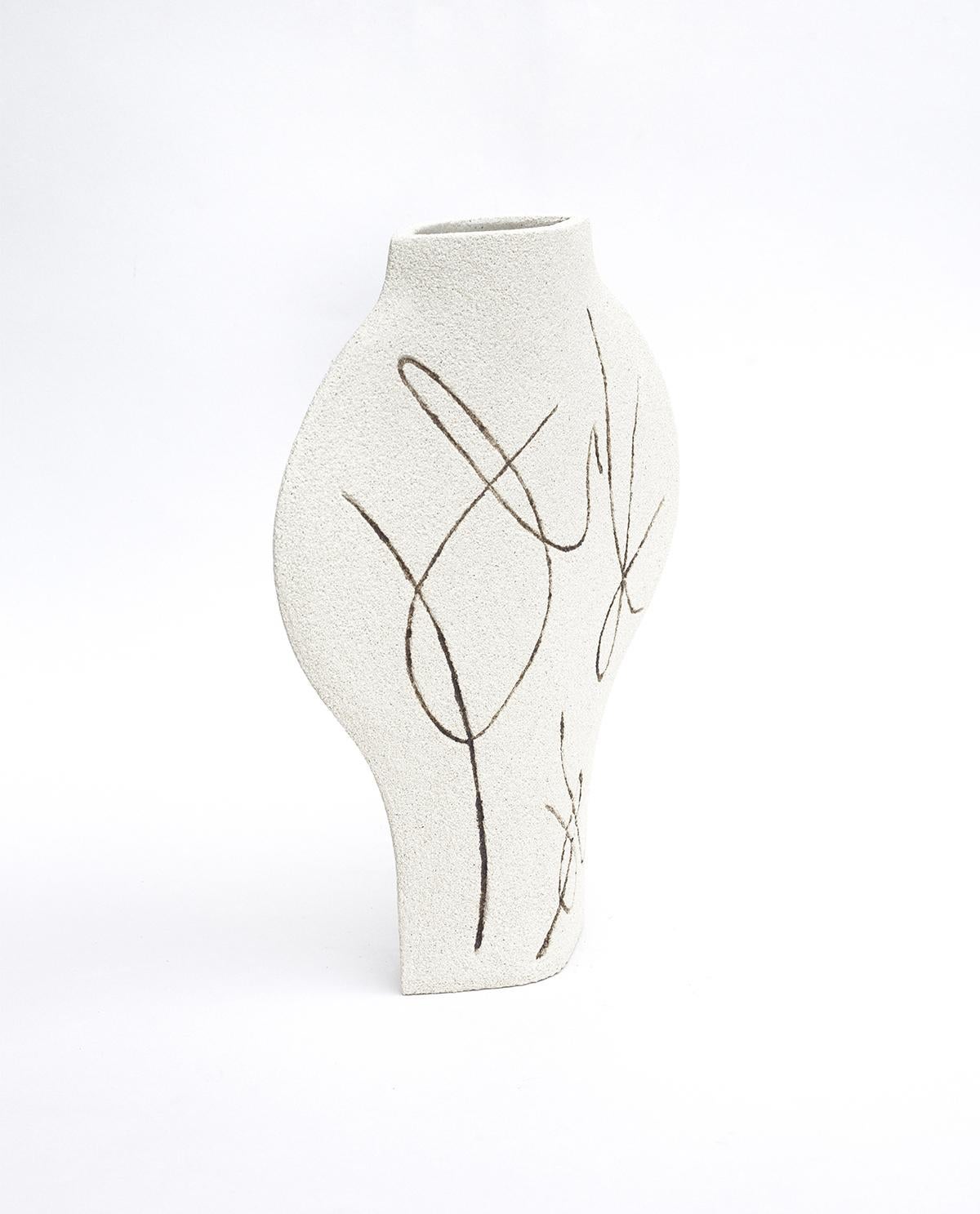 ‘Dal Lines’ Ceramic vase 

This vase is part of a new series inspired by iconic Art (and more precisely paintings) movements. Here is our DAL model with motifs based on abstract illustrations. They are hand-carved to the vase before its first