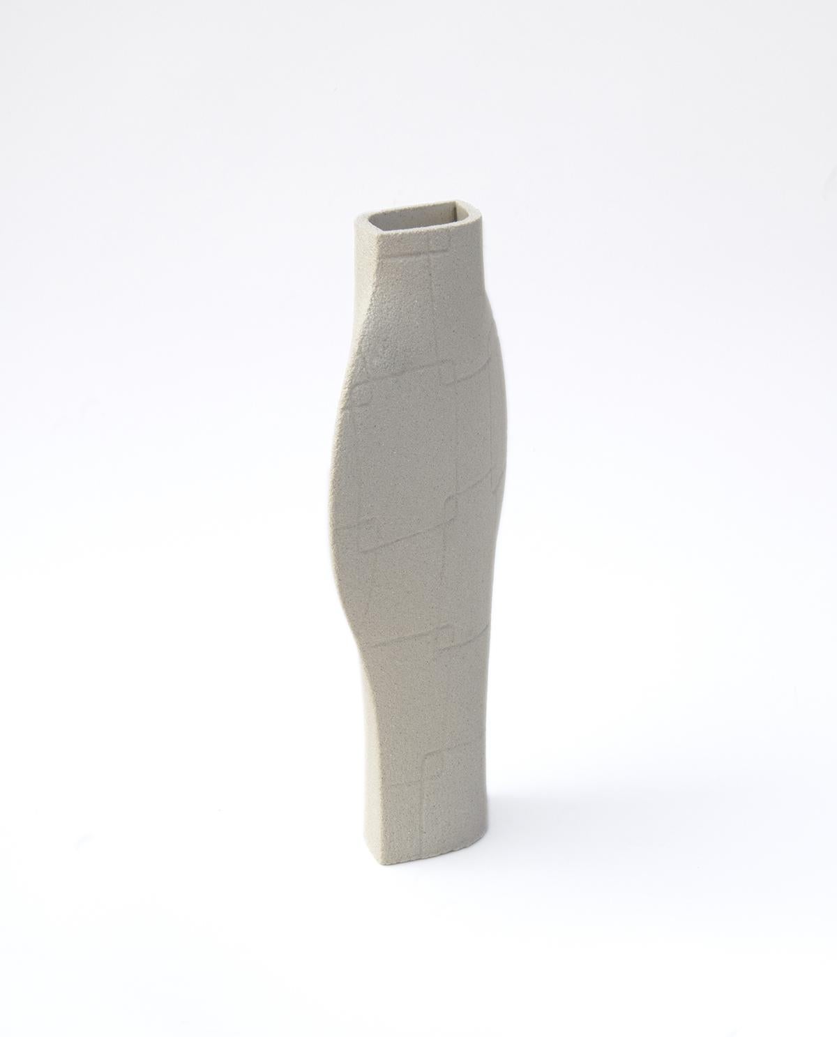 ‘DAL N°1 - WHITE’ Ceramic Vase 

Measures: H: 25 CM / L: 20 CM
H: 10 INCH. / L: 8 INCH.

- Stoneware fired at high temperature finished with transparent glossy glaze inside.
- Raw carved exterior showcasing the natural aspect of the clay’s