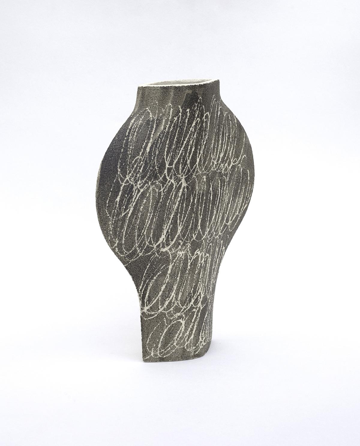 ‘Dal Negative Circles Black’ ceramic vase

This vase is part of a new series inspired by iconic Art (and more precisely paintings) movements. Here is our DAL model with motifs based on abstract paintings. The motifs are applied to the vase before
