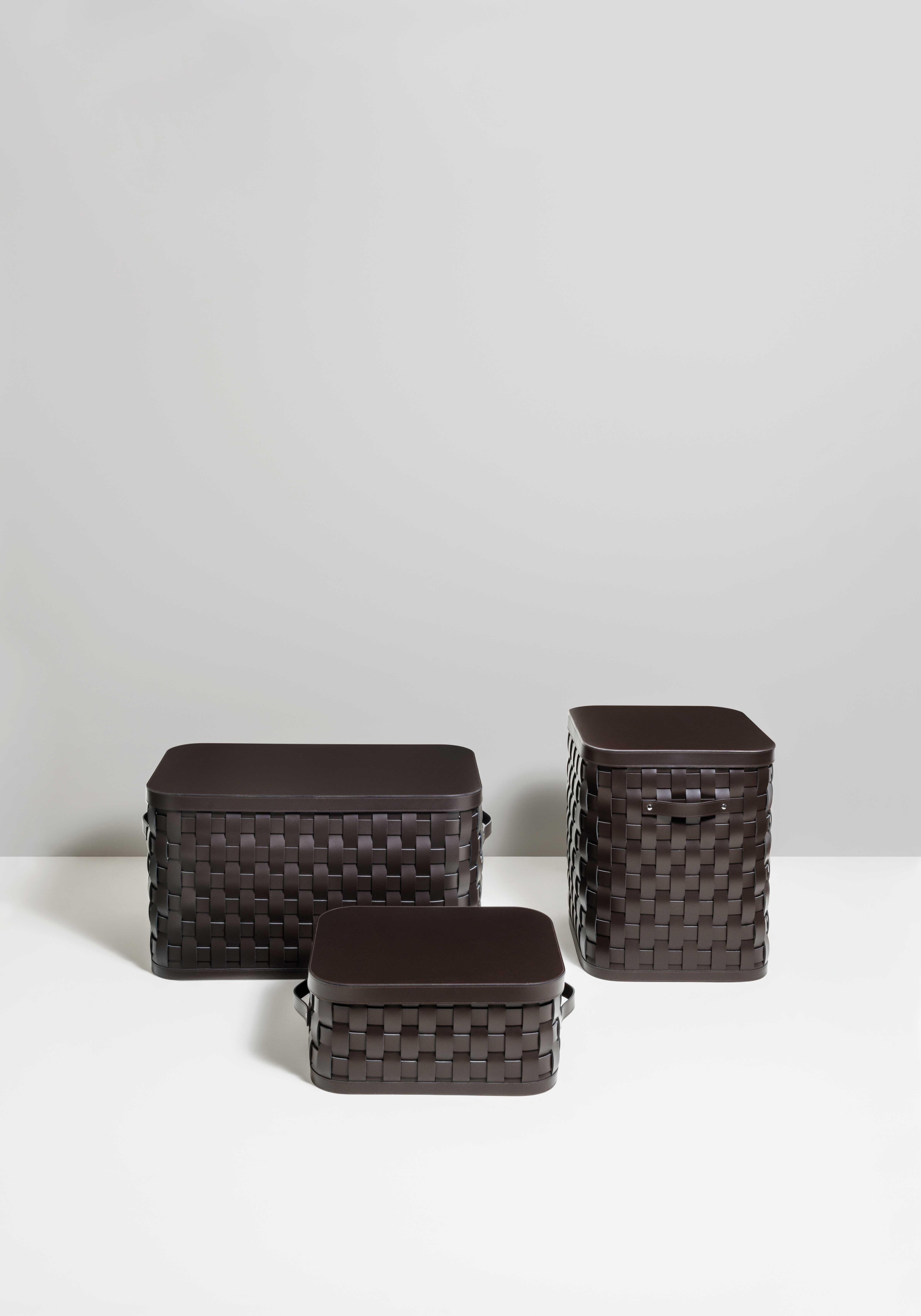 A real eye-catcher.

 Part of the Demetra series, Pinetti low rectangular basket is strictly hand woven. Made with water-resistant and washable bonded leather useful also for outdoor use this basket is completed with a smooth brown leather