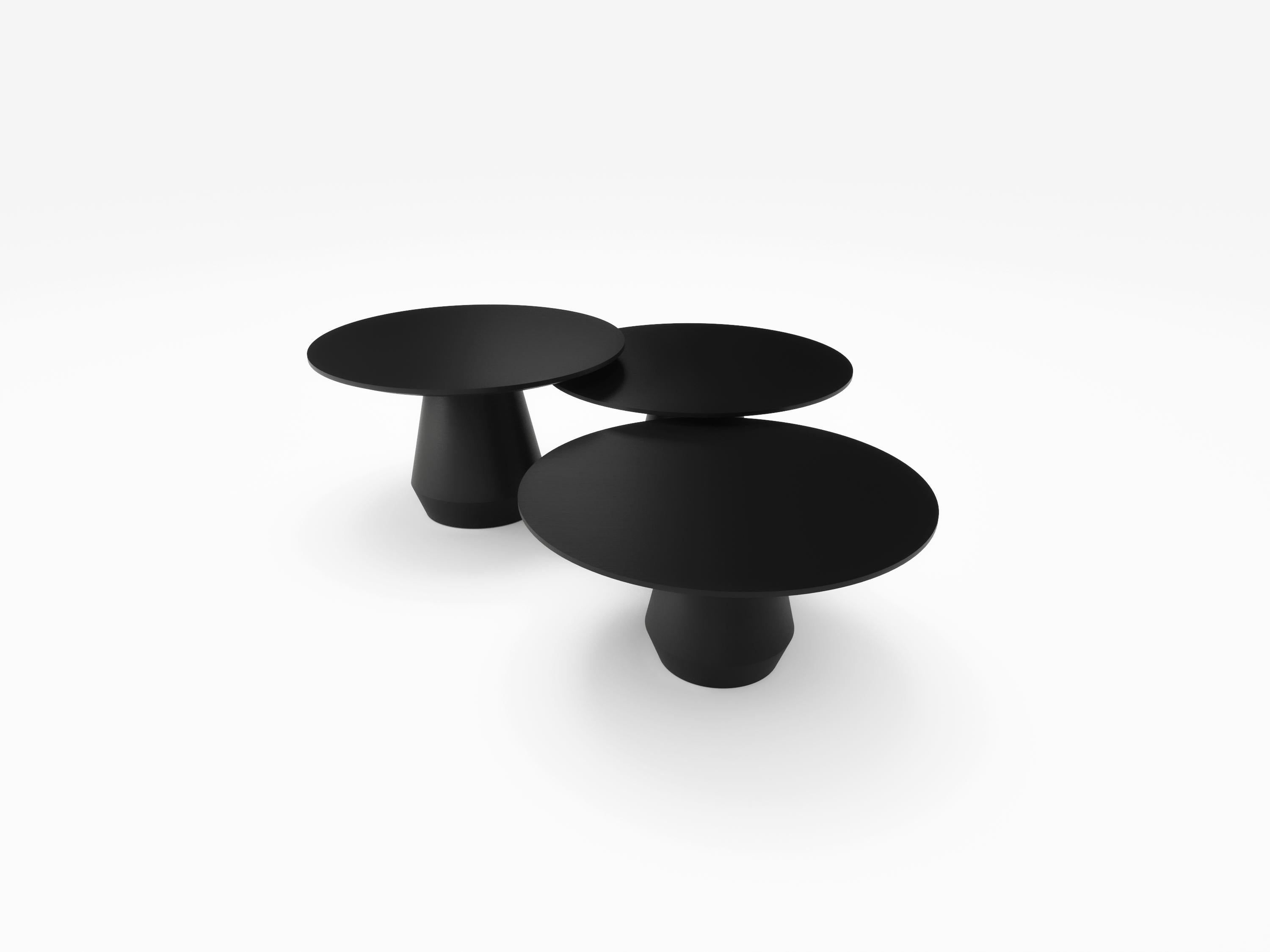 21st Century Designed by Collector Studio Charlotte Triple Center Table Black 

Is like having a huge block of wood and turn it in a huge lathe, making it look like it’s revolved shape was originated by a single gesture. This wooden table will not