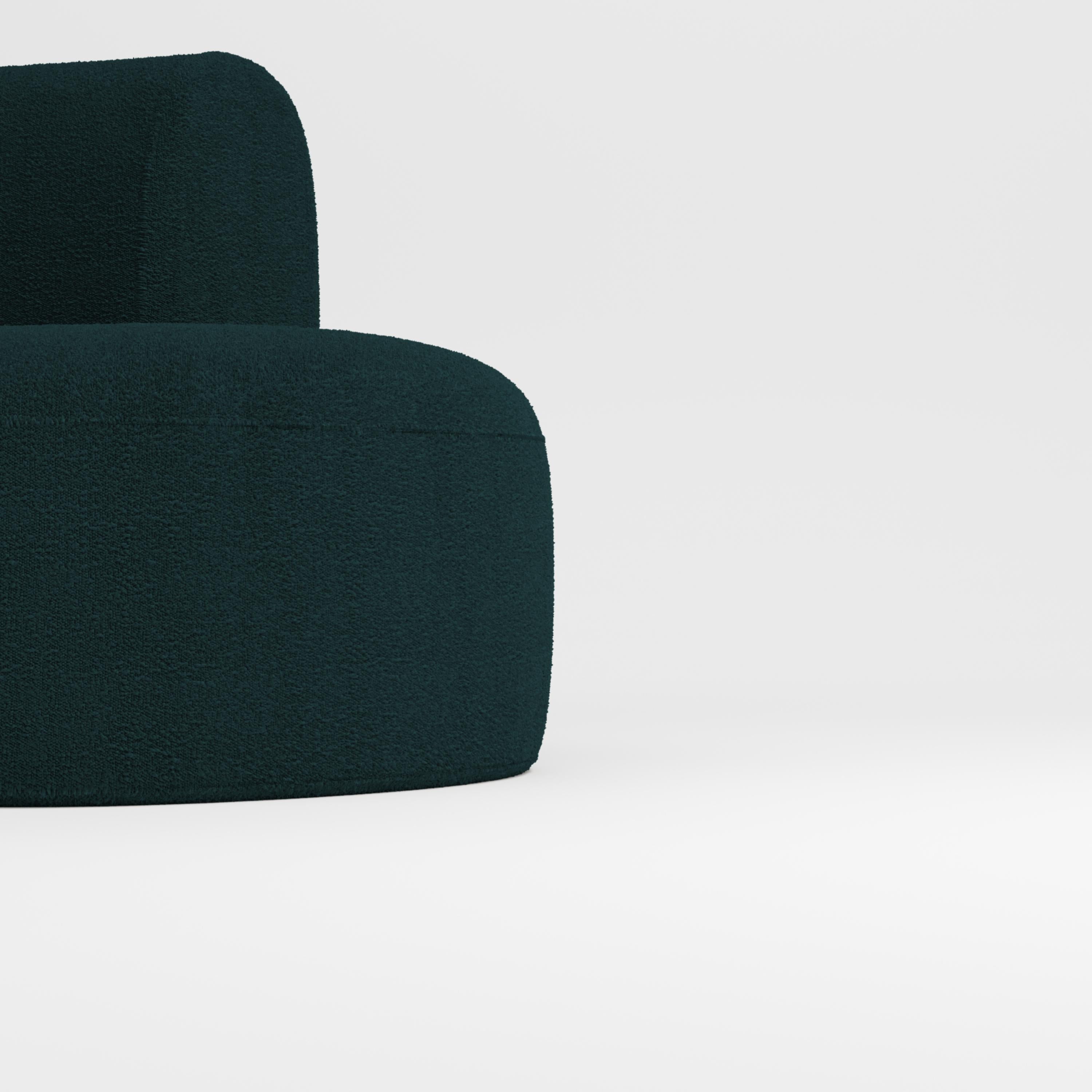 Hug sofa is defined by clean, simple lines and a distinctive armrest detail.
The armrest, half overlapping the seat cushion, creates an interlocking detail between the two elements, while the padding, firm and welcoming at the same time,