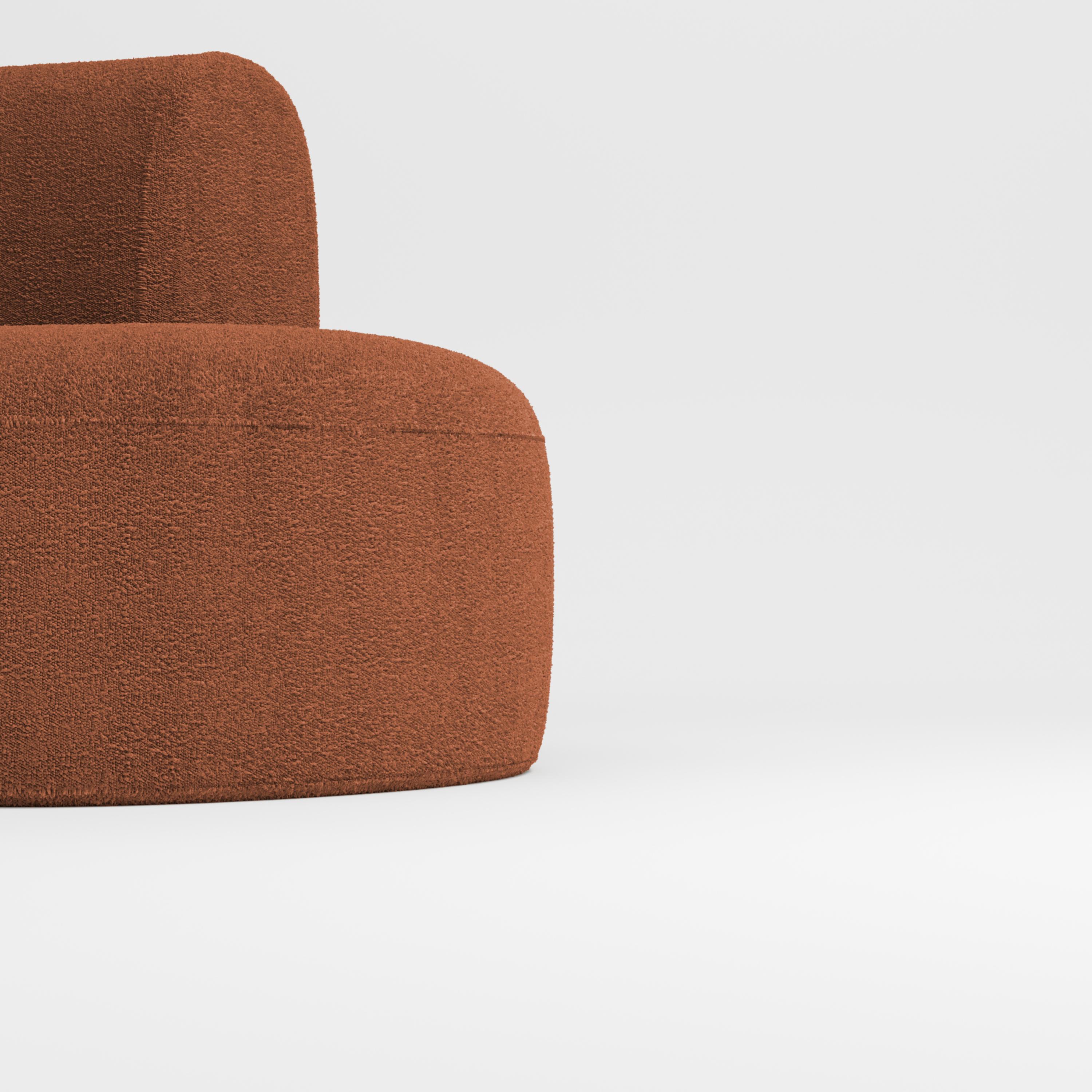 Hug sofa is defined by clean, simple lines and a distinctive armrest detail.
The armrest, half overlapping the seat cushion, creates an interlocking detail between the two elements, while the padding, firm and welcoming at the same time,
