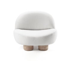 Poltrona Hygge moderna e contemporanea in tessuto e travertino di Collector Studio A