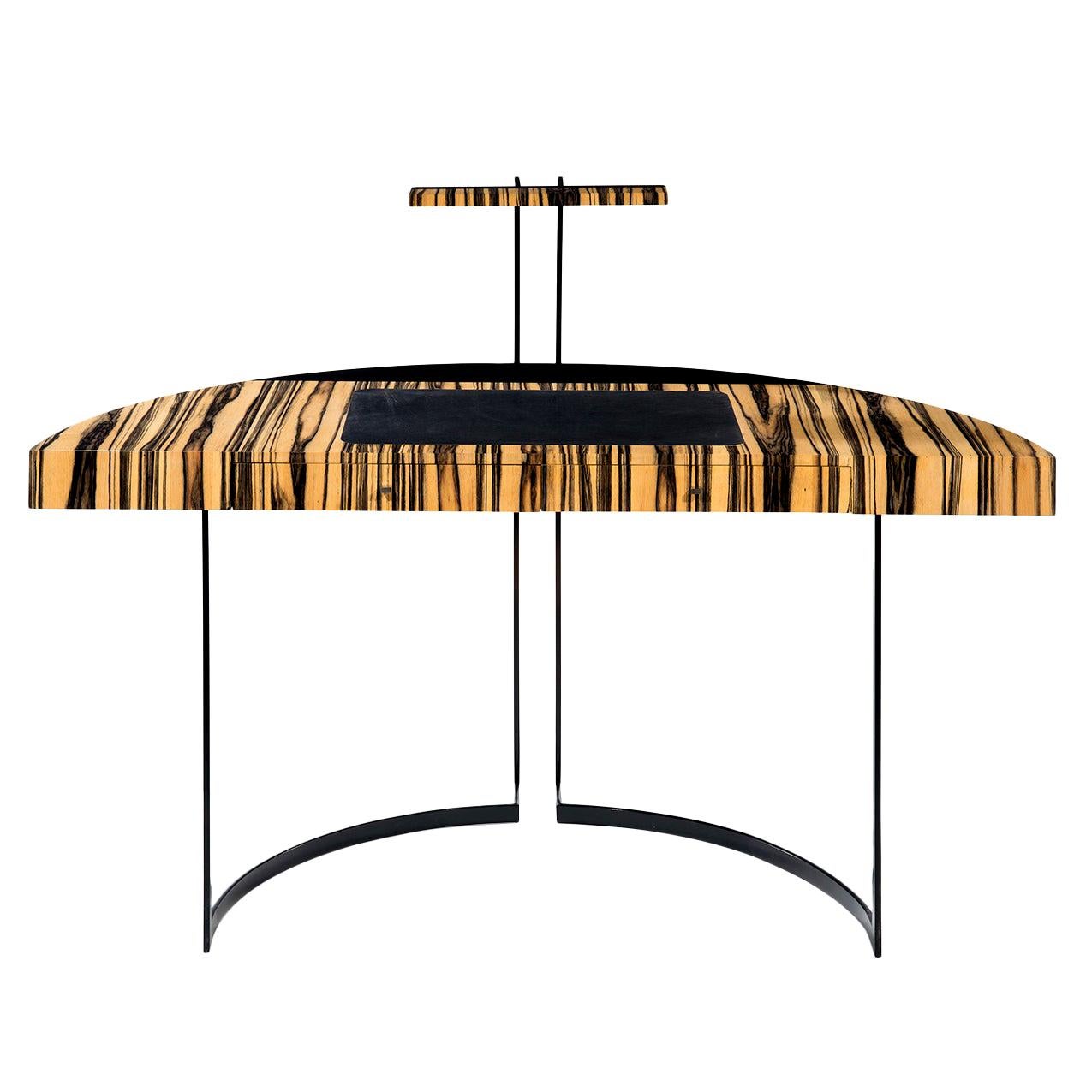 A semi-circular black lacquered metal legged desk with a white ebony veneer top and black leather desk blotter. The top of the back legs ends with a LED light.

Do not hesitate to ask for a shipping quote to get the best offer.


Aymeric Lefort