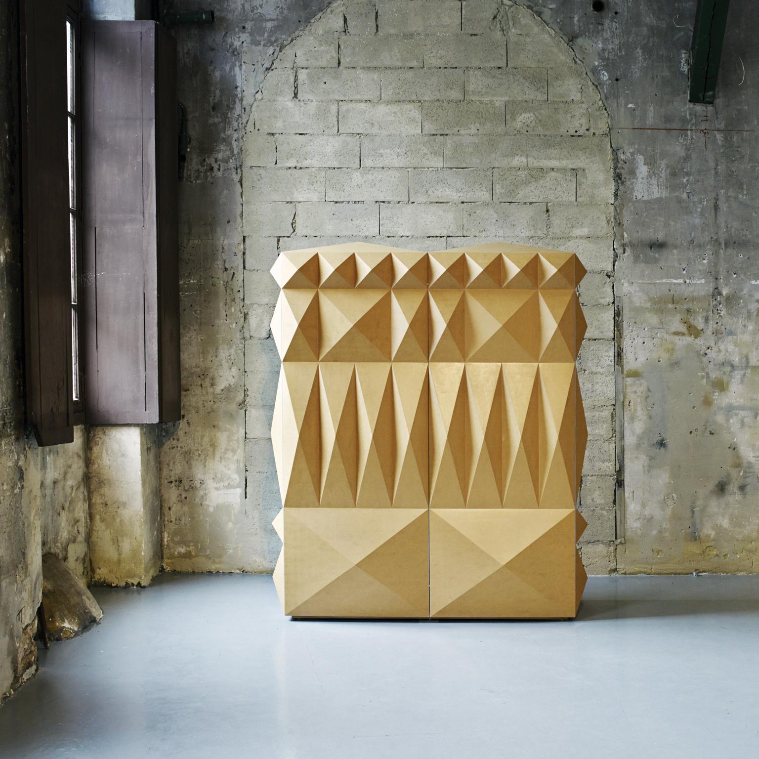 I Diamanti is a collection of hand painted cabinets, made of wood with extruded geometric shapes inspired to the Palazzo dei Diamanti in Ferrara. The collection is custom unique project and each piece is unique due the geometrical and colors