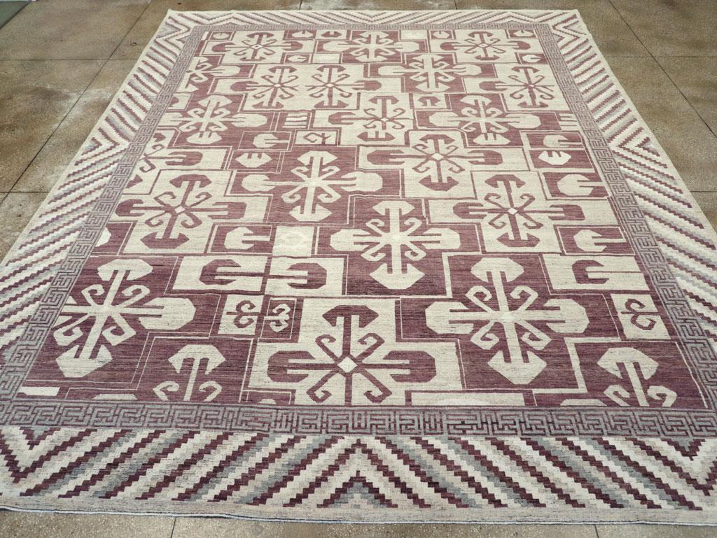 Un tapis moderne du Turkestan oriental Khotan de grande taille, fabriqué à la main au cours du 21e siècle.

Mesures : 12' 1
