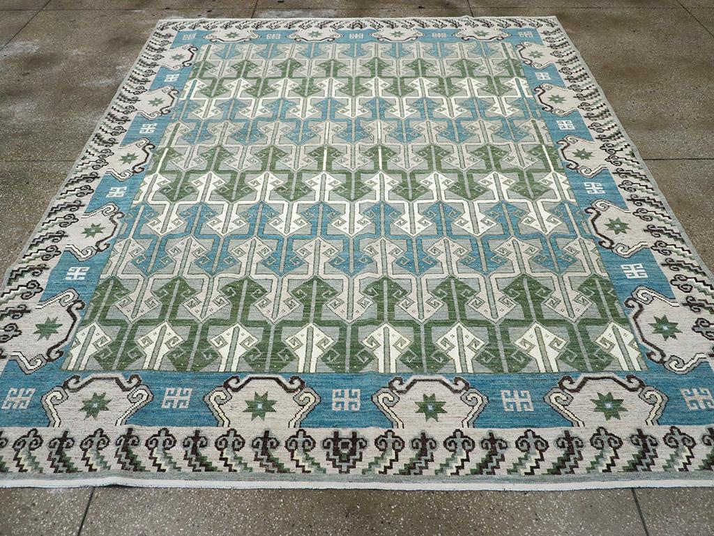 A modern East Turkestan Khotan room size carpet handmade during the 21st century.

Measures: 8' 5