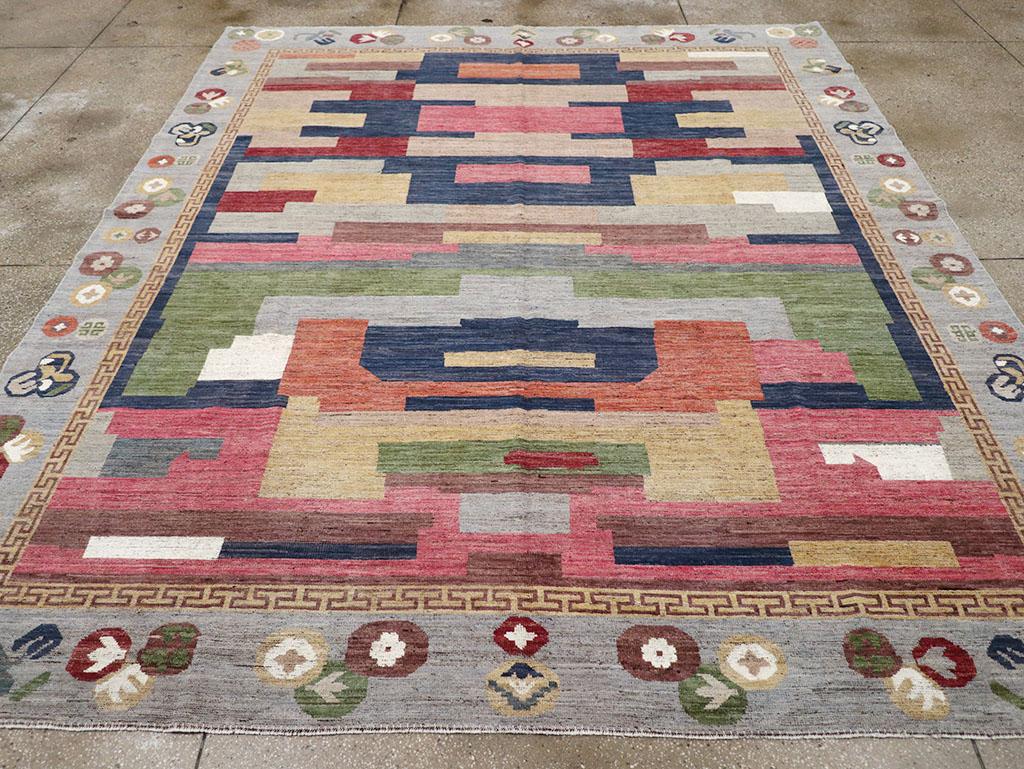 A modern East Turkestan Khotan room size carpet handmade during the 21st century.

Measures: 9' 6