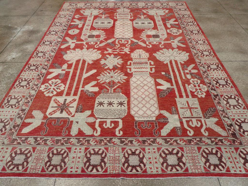 Tapis moderne du Turkestan oriental Khotan, fabriqué à la main au cours du 21e siècle.

Mesures : 9' 10