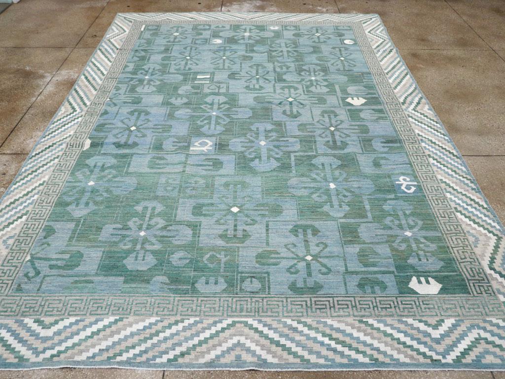 Tapis moderne du Turkestan oriental Khotan, fabriqué à la main au cours du 21e siècle.

Mesures : 10' 2