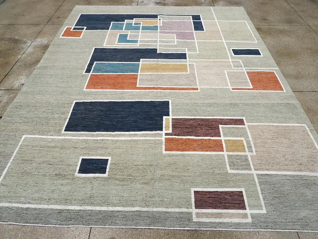 A East Turkestan Modern room size carpet handmade during the 21st century.

Measures: 10' 2