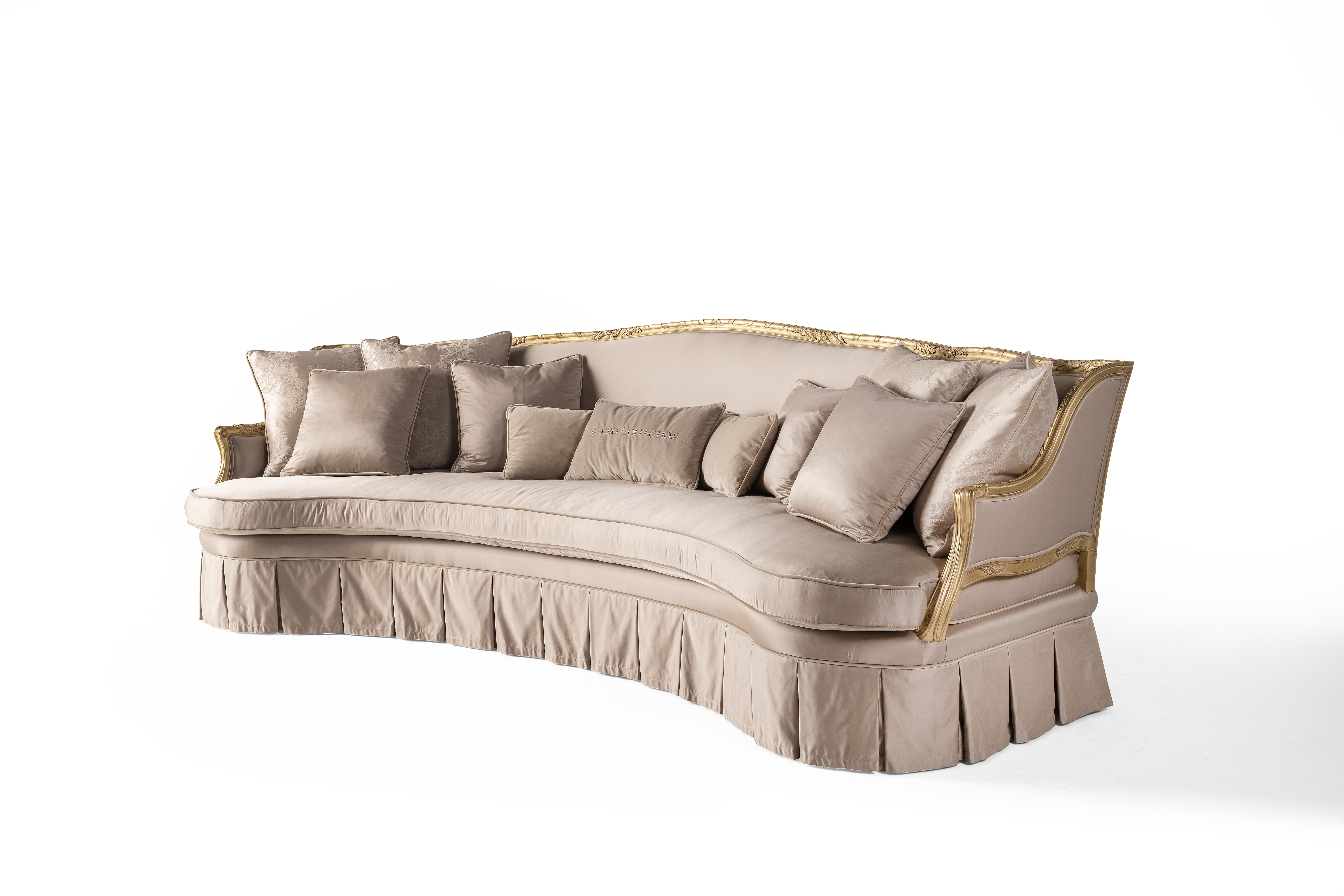 Seductive lines and precious details for the Eglantine collection. Its soft and welcoming shapes are embellished by a hand-carved profile with gold leaf finishing and by the ruching of the fabric that enriches the base. The perfect furniture for a