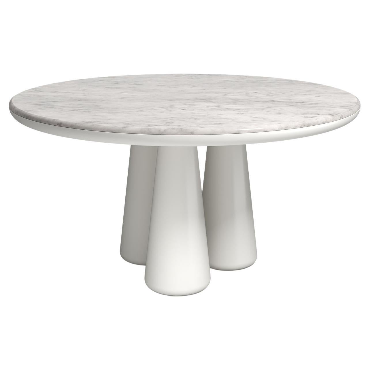 Isotopo table design by Elena Salmistraro, product by Scapin Collezioni
Limited Edition

A vibrant round top is combined with a sculptural base made of three rounded conical supports that give the product a strong