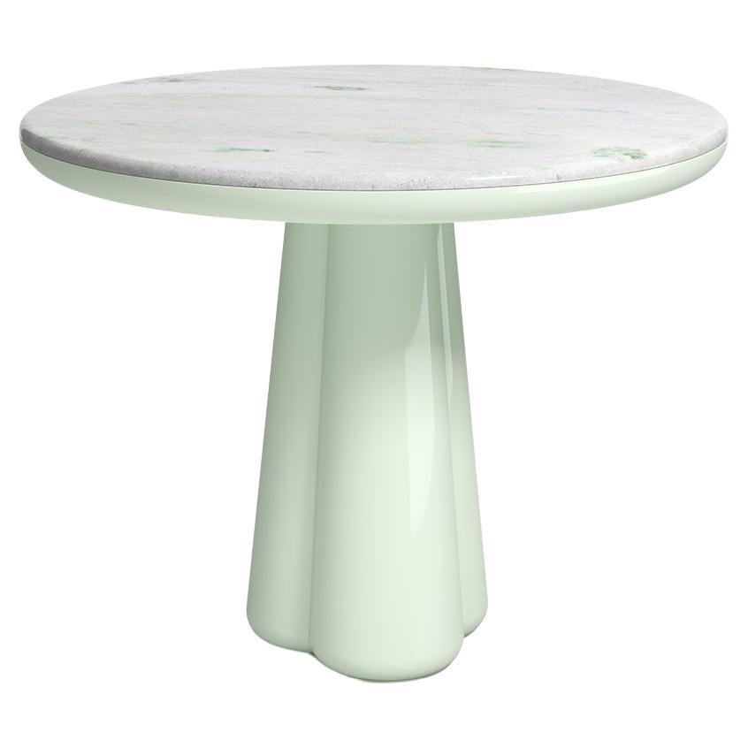 Isotopo table design by Elena Salmistraro, product by Scapin Collezioni
Limited Edition

A vibrant round top is combined with a sculptural base made of three rounded conical supports that give the product a strong