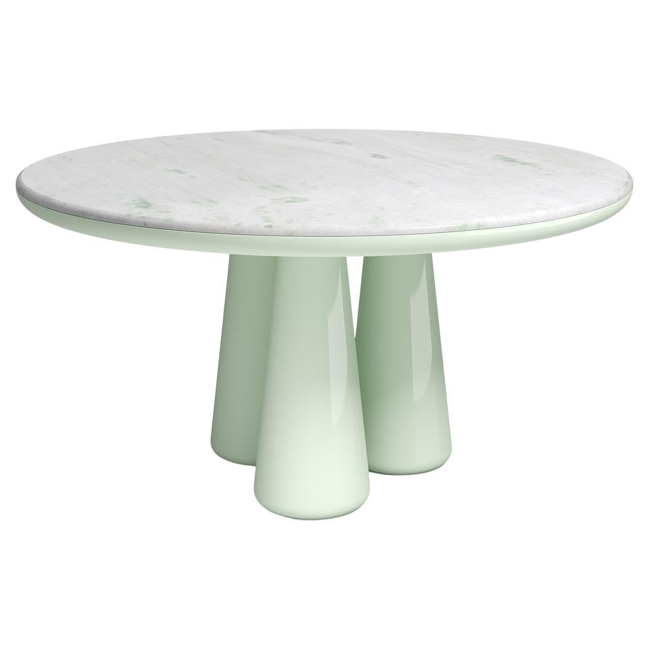 Isotopo table design by Elena Salmistraro, product by Scapin Collezioni
Limited Edition

A vibrant round top is combined with a sculptural base made of three rounded conical supports that give the product a strong