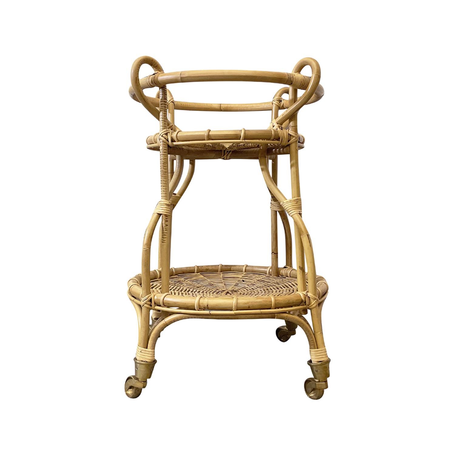 This designer trolley made of Rattan lends itself to the interior use only. Franco Albini designed the original Trolley. This bar cart is both stylish and functional. The frame features beautiful rattan, carefully crafted to support multiple trays
