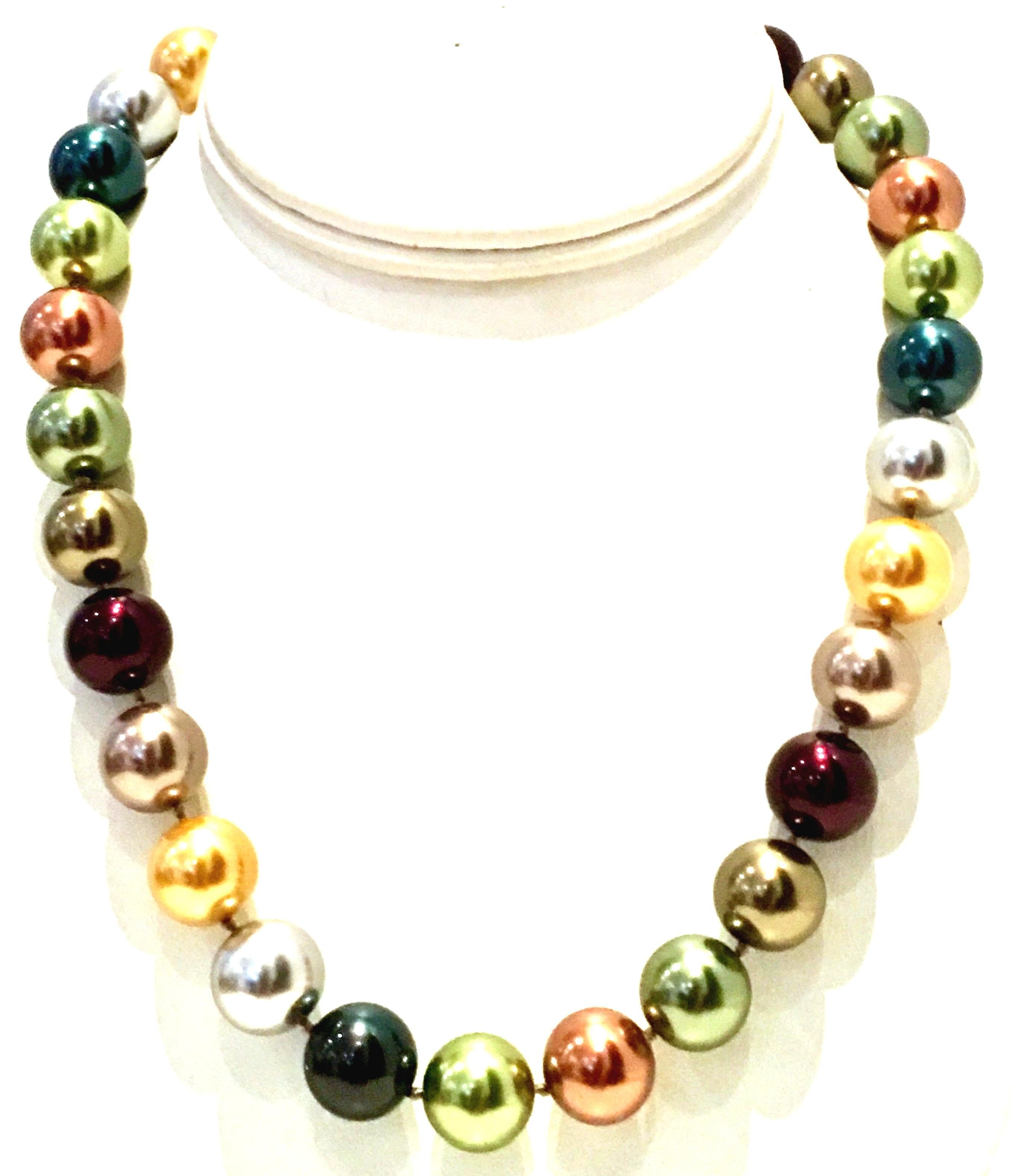 2009  Faux Pearl Bead Multi Color Choker Style Necklace By, Kenneth Jay Lane. Features multi colored faux pearls in metallic, gold, rose gold, silver, black, green and amethyst with gold plate detail. Signed KJL on hang tag adjustable clasp. Each