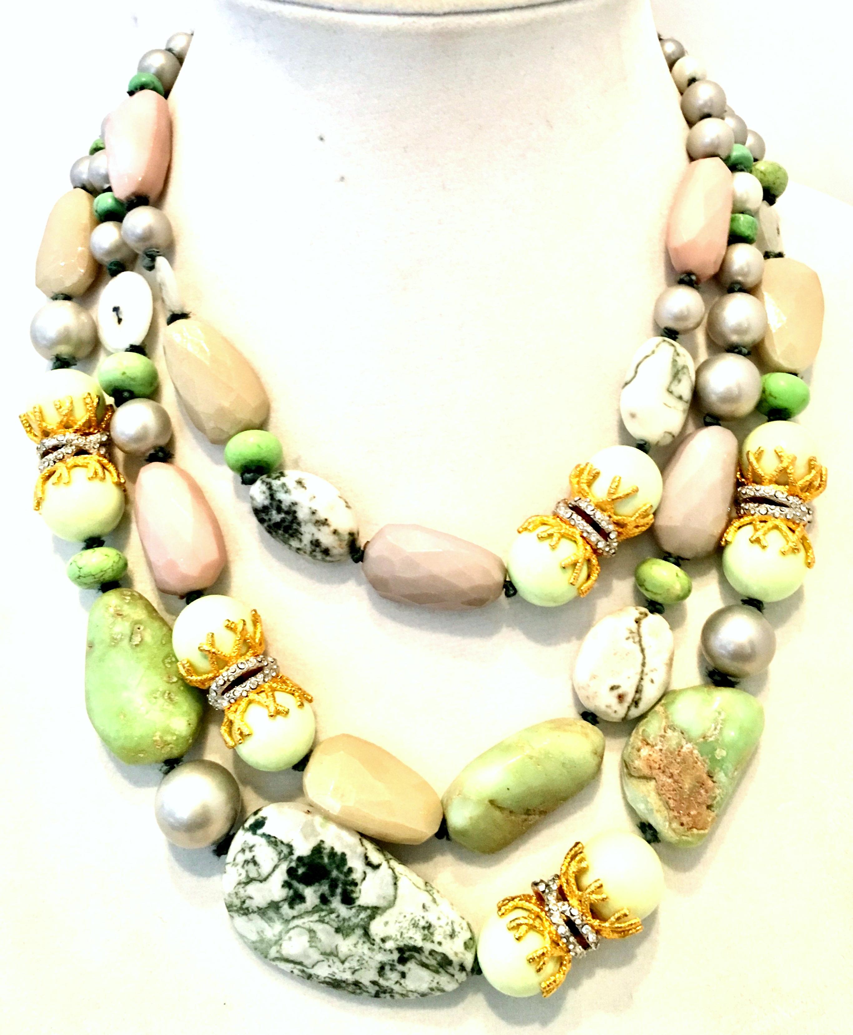21st Century Contemporary Faux Pearl Bead,  Natural Gemstone & Swarovski Crystal Multi Strand Necklace By, Alexis Bittar. This coveted and dramatic statement piece features, silver faux pearl beads, turquoise beads, free form natural polished moss