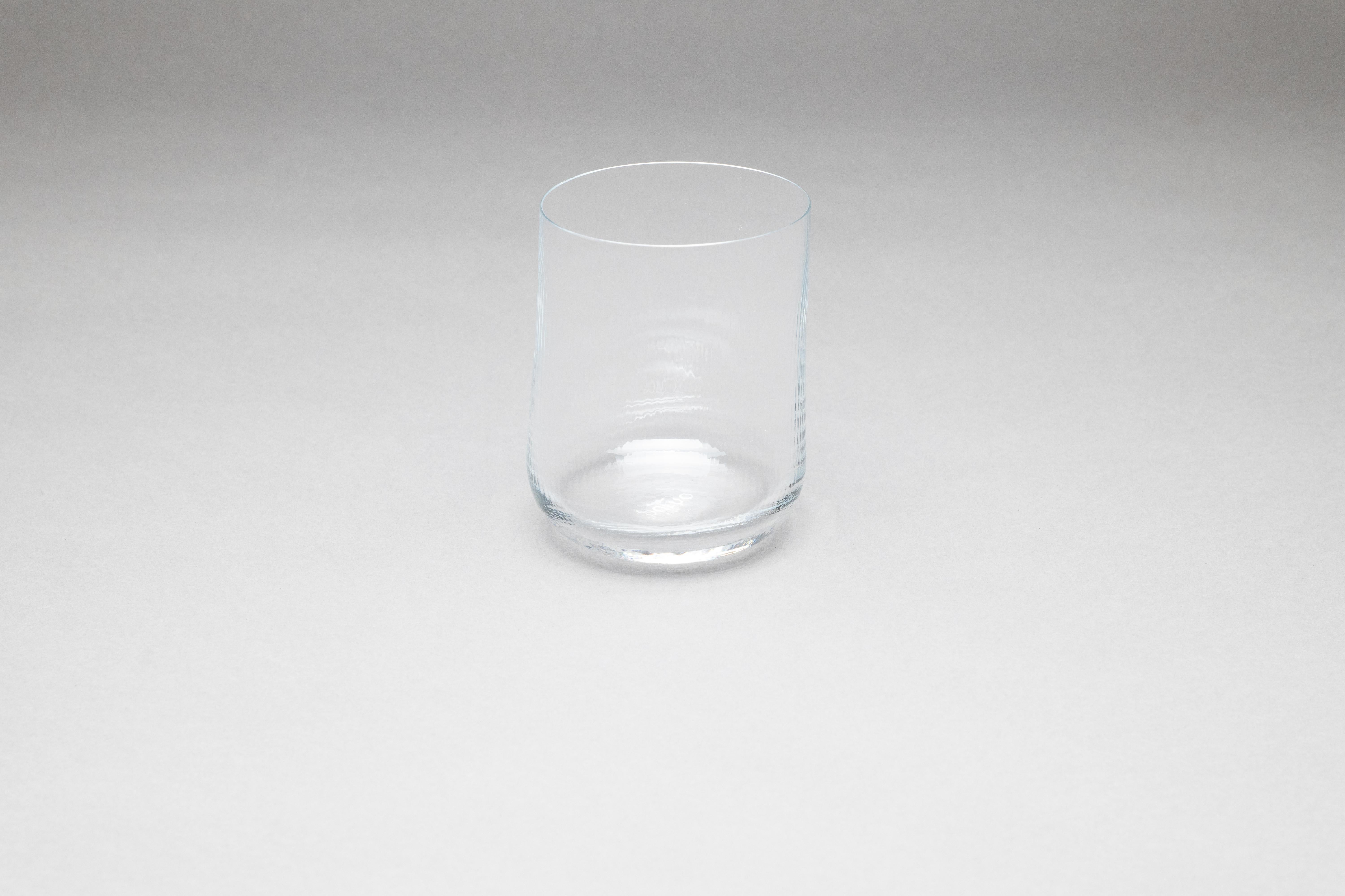 Stilla, the Latin word for a drop of water. Liquid, transparent, perfect. 
Federico Peri designed the Stilla Liquida glasses for Purho in spring 2024,  tumblers with textured surfaces and gentle, vaguely elliptical shapes, produced in two sizes,