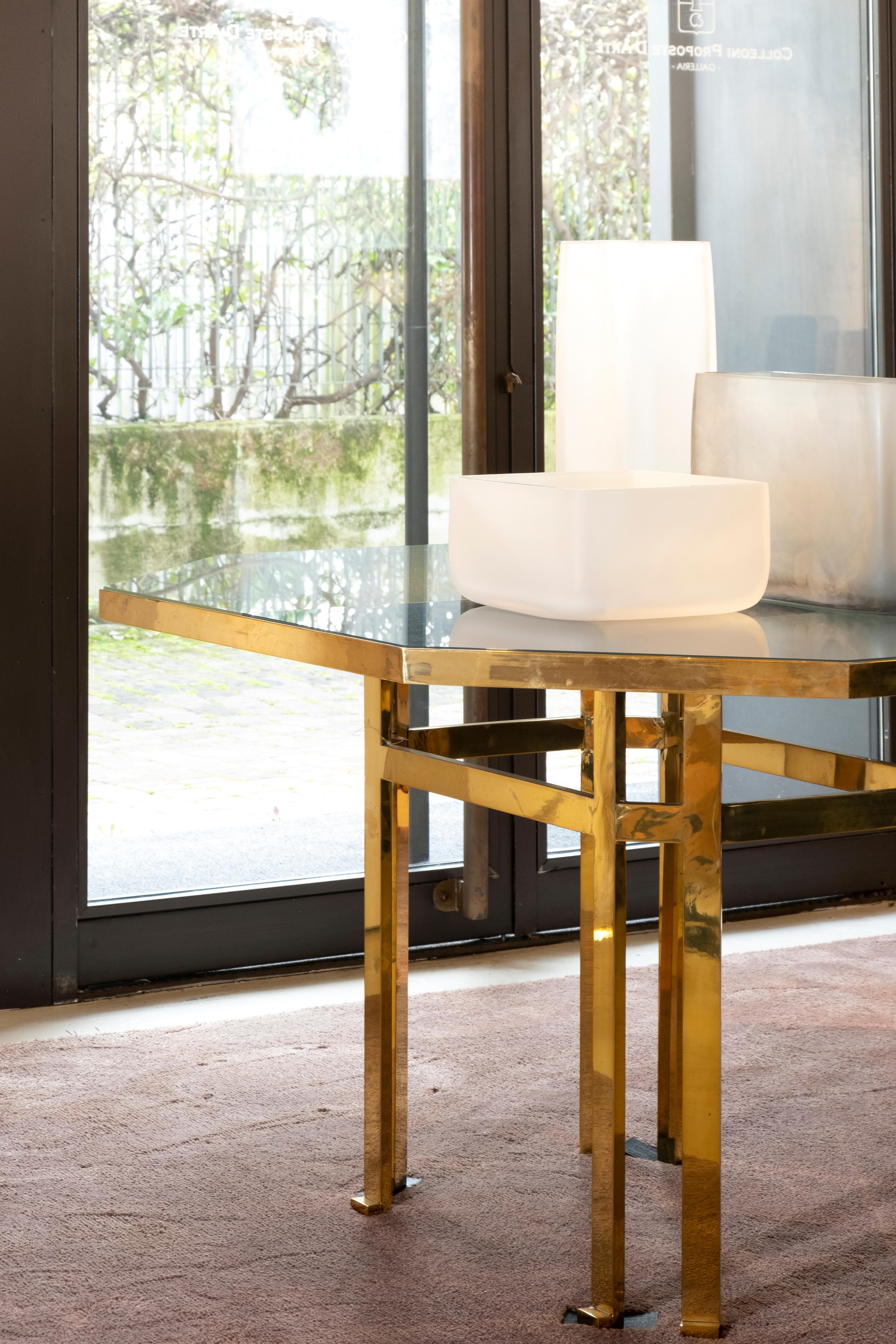 21st century Filippo Feroldi brass table 130 back-colored glass top various colors
designed by Filippo Feroldi for Purho and Colleoni Arte, Holo 130 is characterized by small dimensions and by an octagonal brass structure surmounted by a sheet of