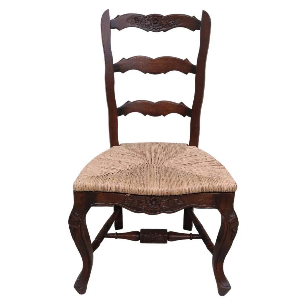 This beautiful country French ladderback chair is made of solid plantation grown mahogany. The shaped back, seat rails, cabriole legs and stretchers all feature gorgeous floral carvings, making this chair anything but ordinary. Finished with a
