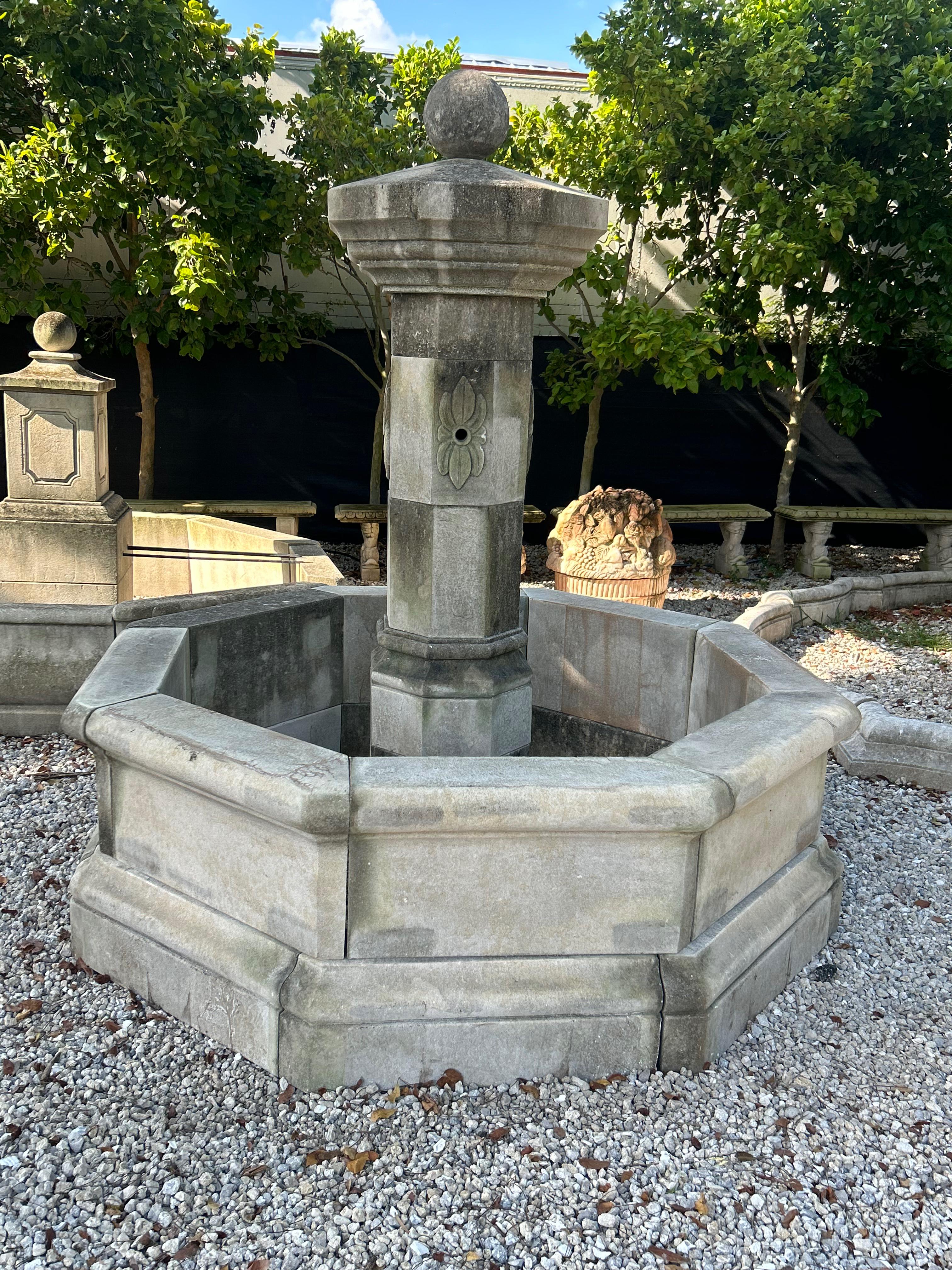 This traditional French central garden fountain has been carved in limestone after an 17th Century original Haute Epoque Renaissance Louis XIII style. This Provencal limestone water feature is often seen throughout the charming villages in the South