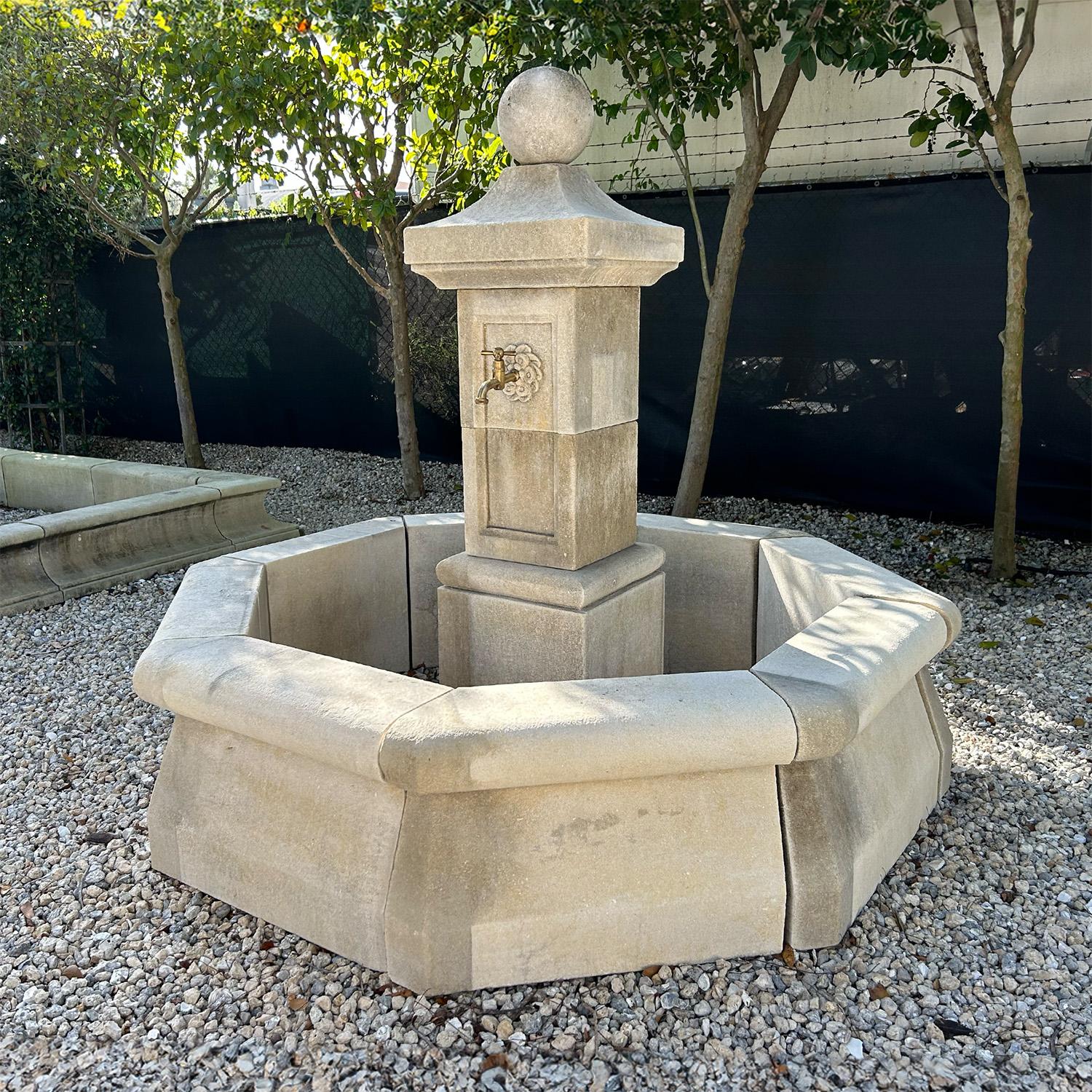 The very traditional octagonal garden fountain was hand carved in limestone after an 18th century original (fountain du reservoir) and can still be seen nowadays in the French villages. This Provencal water fountain has a square paneled central