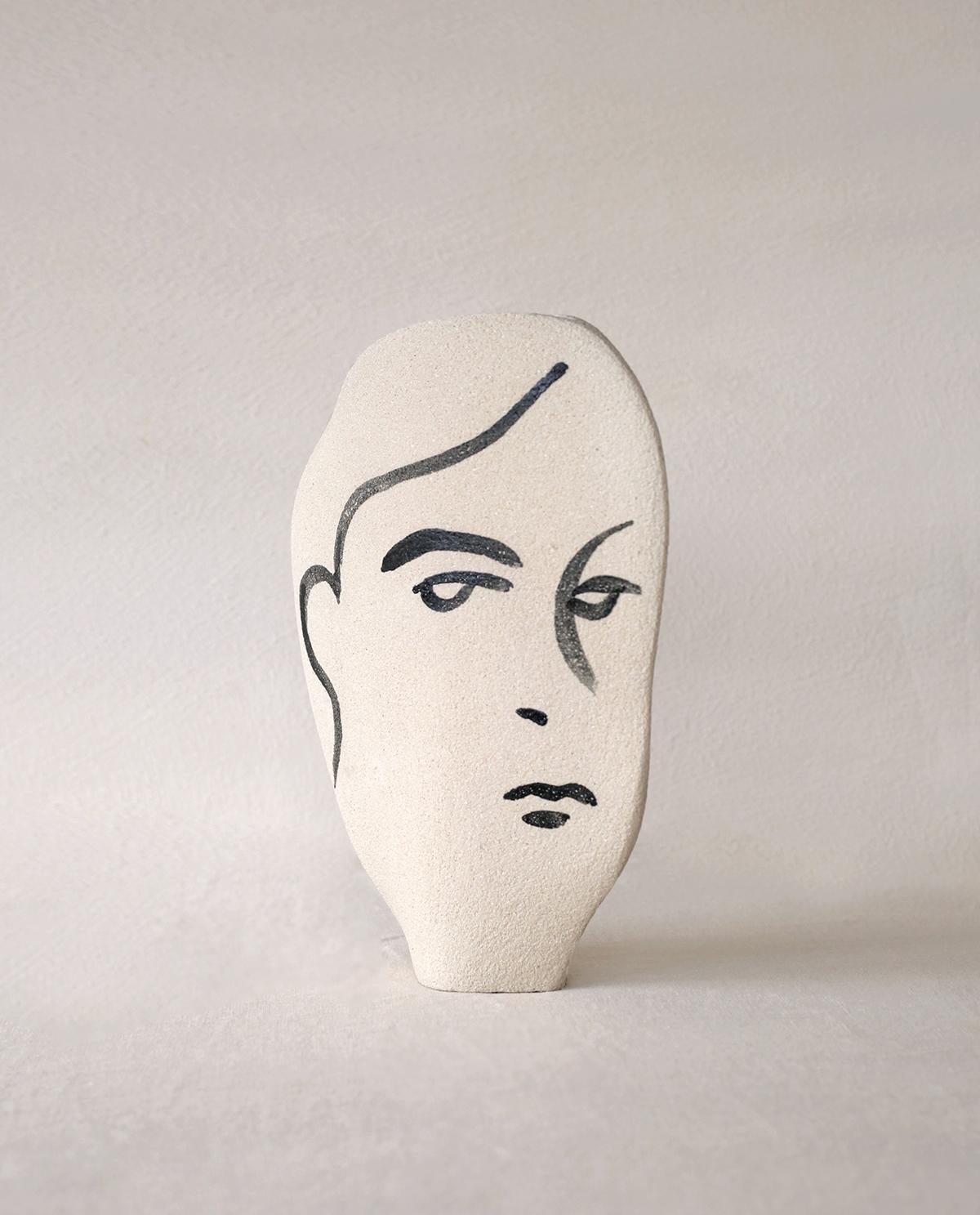 ‘Frida N°1’ Handmade Ceramic White Vase

This vase is part of a new series inspired by human faces and portrait illustrations. Here is a new shaped model, the ‘Frida N°1', with hand-painted figurative motifs applied with a brush before the first