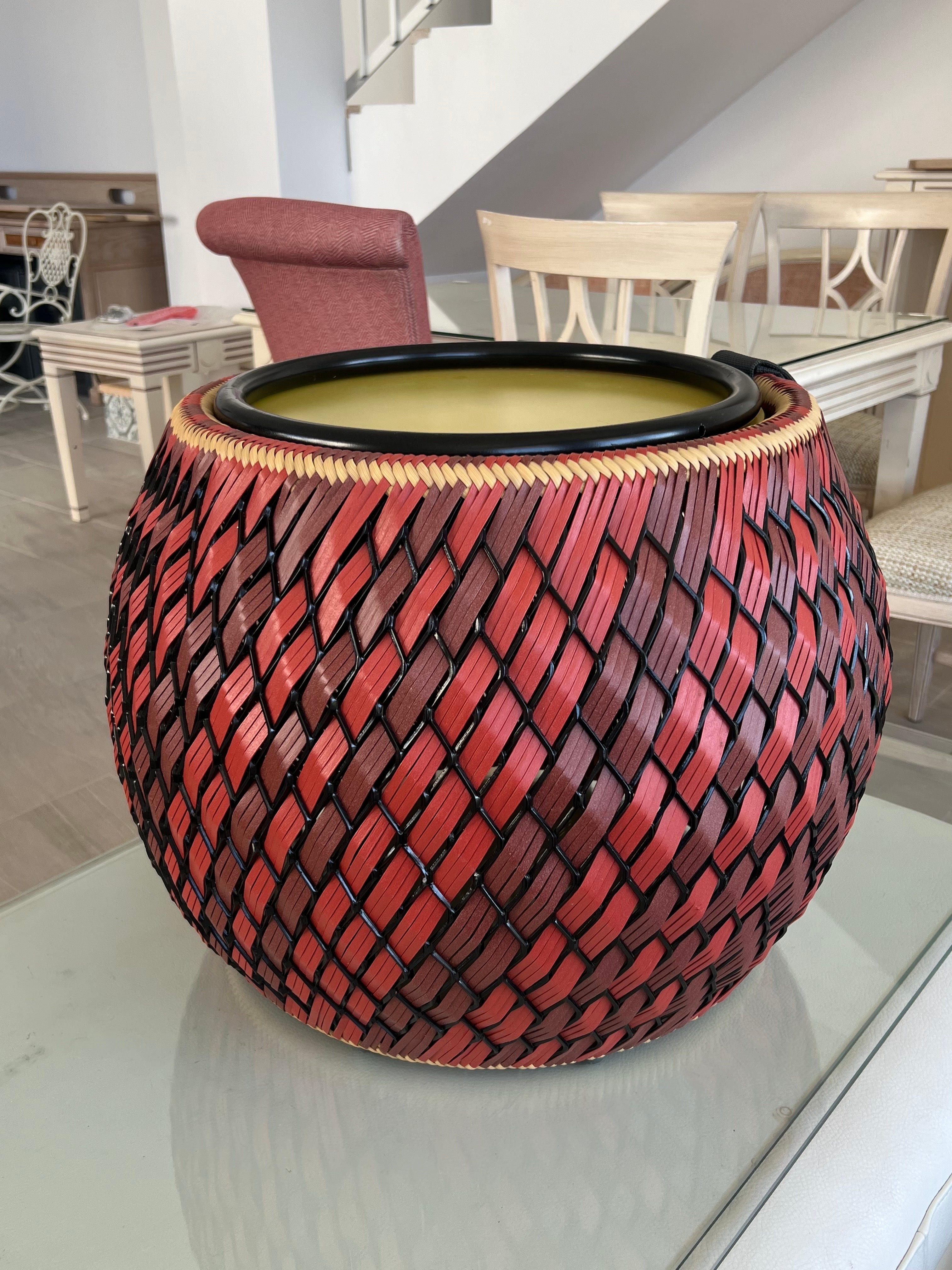 21st Century German Dala red round table by Dedon designed by Stephen Burks. The frame is electrostatic powder-coated aluminium. Fiber is High-Density Polyethylene (HDPE). Tabletop is lacquered green glass and it is
the same diameter as the DALA