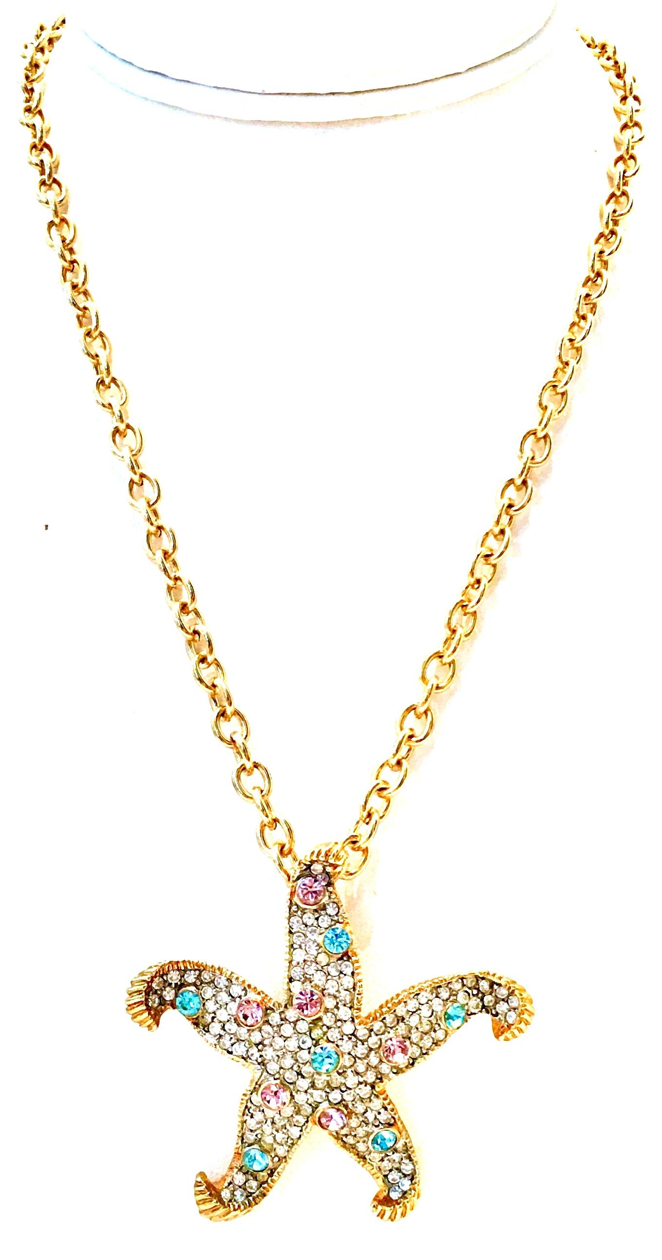 21st Century Gold Plate & Swarovski Crystal Starfish Pendant Necklace By, Kenneth Lane.
This gold plate brilliant pave set Swarovski crystal starfish necklace features and abstract and dimensional starfish pendant of approximately, 2.25