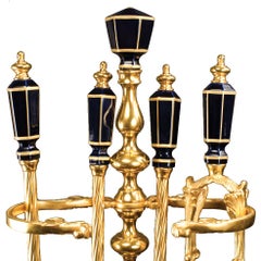 Utensilios para chimeneas de bronce dorado y porcelana del siglo XXI