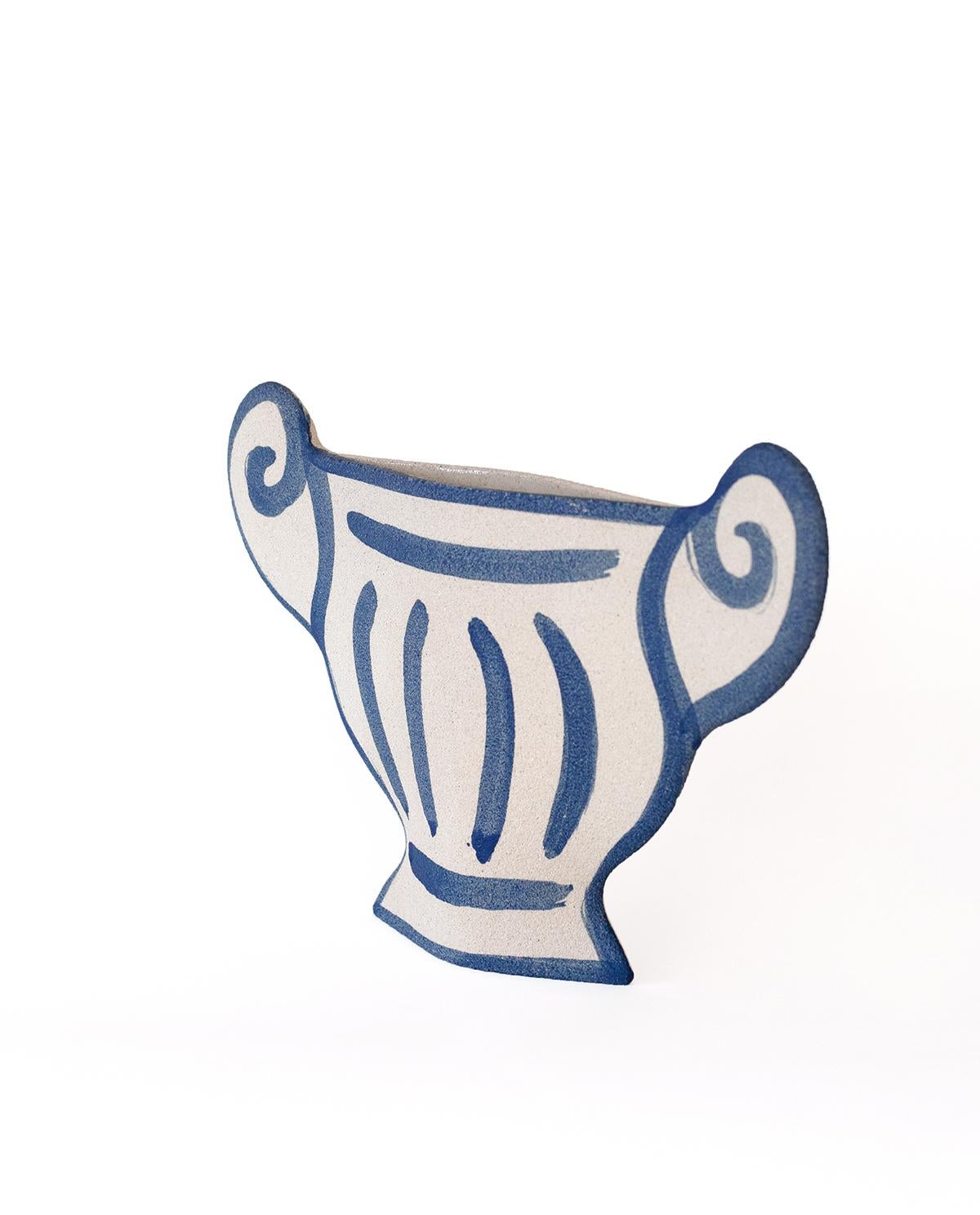 A part of a captivating new line blending ancient Greek pottery with contemporary design, the ‘Greek Coupe’ vase showcases delicate blue underglaze illustrations that harmonize traditional and modern aesthetics.
Crafted by our designer, the blue