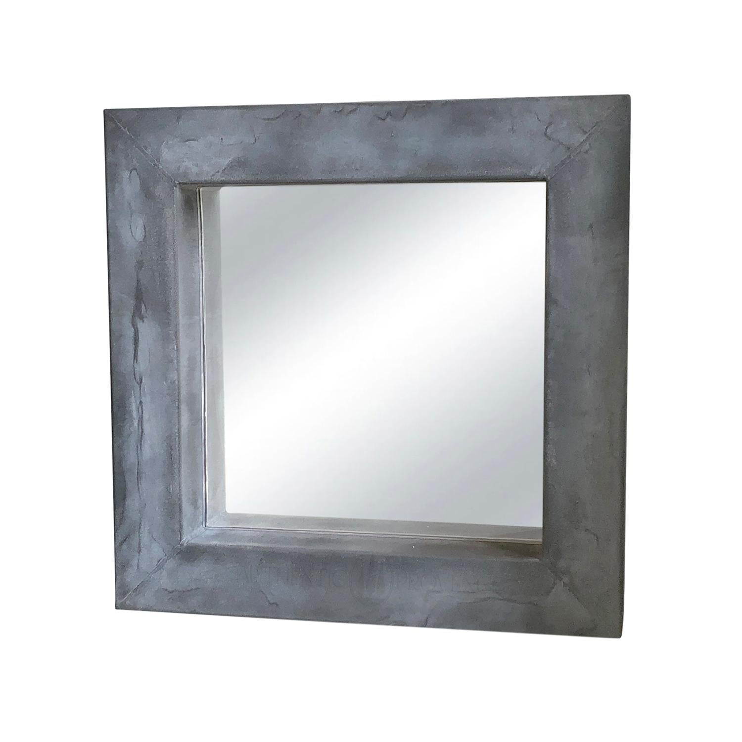Our beautiful grey square Belgian metal mirrors can be used in many ways in a garden or outside space, playing clever tricks with the eye, a mirror can make a space feel bigger and bring light into an enclosed area.
