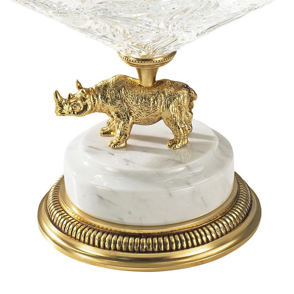 21st century hand carved clear crystal and golden bronze bowl. This bowl is finely chiseled lost wax castings and hand-grounded crystal. The golden bronze rhinoceros on the base was created with the lost wax technique and has been finely chiseled to