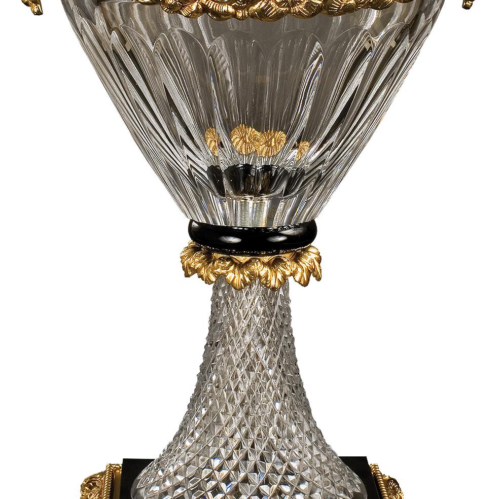 21st Century hand carved clear crystal and golden bronze vase. This vase is finely chiseled lost wax castings and hand ground crystal. On request to customer can modificate the color of crystal: pink, amber, amethist etc... and we can change also