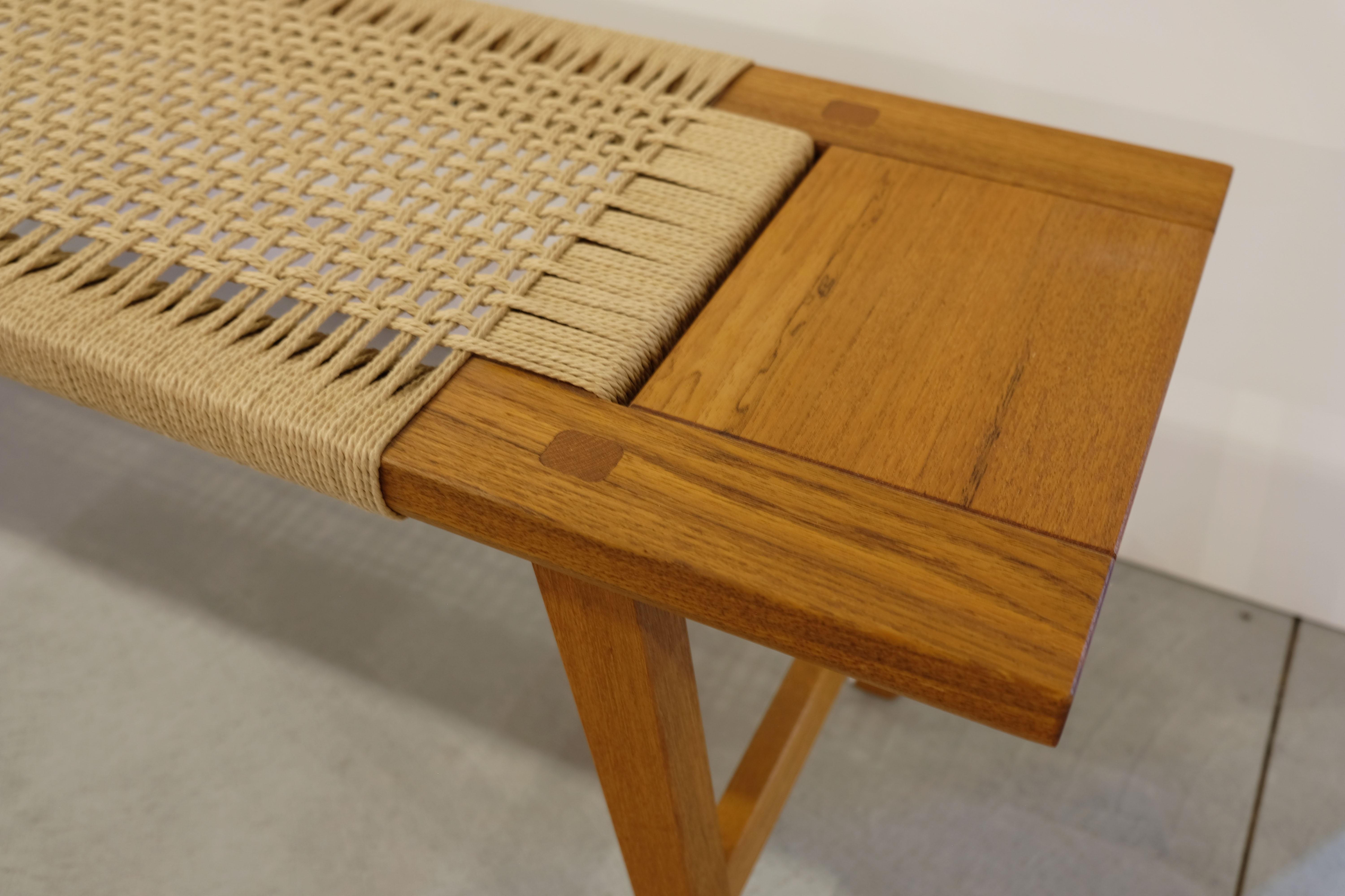 Incredible craftsmanship shines in this hand rushed woven teak bench.