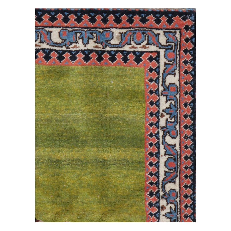 A contemporary Persian Gabbeh accent rug handmade during the 21st century with a pictorial design of a male lion resting over a solid green background.

Measures: 4'4