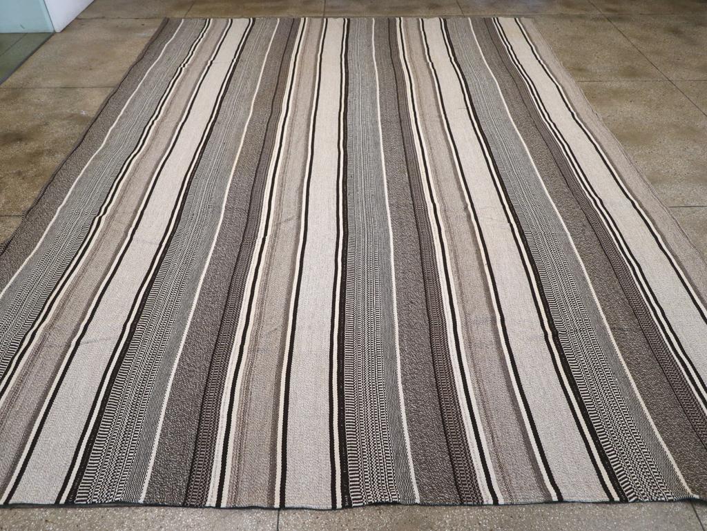 A Turkish Flatweave large carpet in a modern rustic style handmade during the 21st century.

Measures: 12' 3