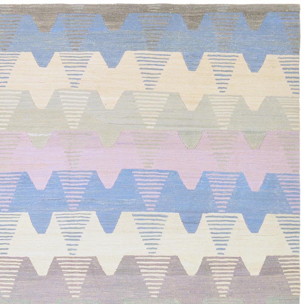 21st century handwoven Anatolian soft color vintage wool Kilim

This special Kilim from Turkey was handwoven with vintage wool in the last few years. The many pastel colors in pink, blue and beige are pleasantly light and fill every room with